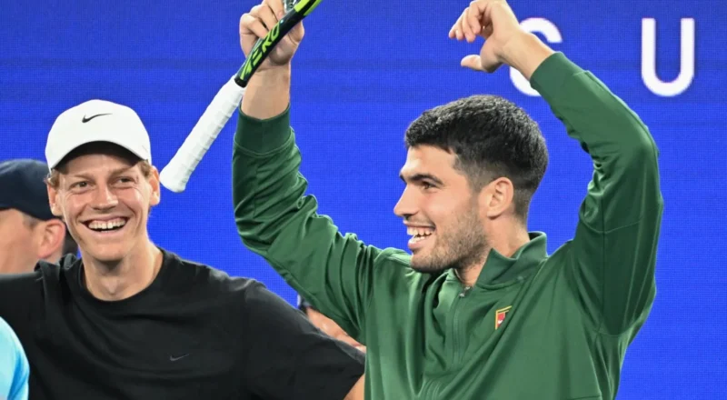 Jannik Sinner and Carlos Alcaraz watch on at the Australian Open
