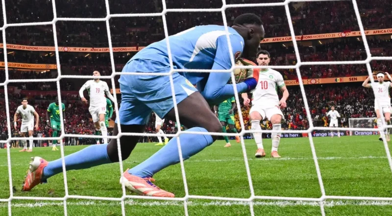 Senegal goalkeeper Eduoard Mendy catches Morocco's Brahim Diaz's Panenka penalty in Africa Cup of Nations final