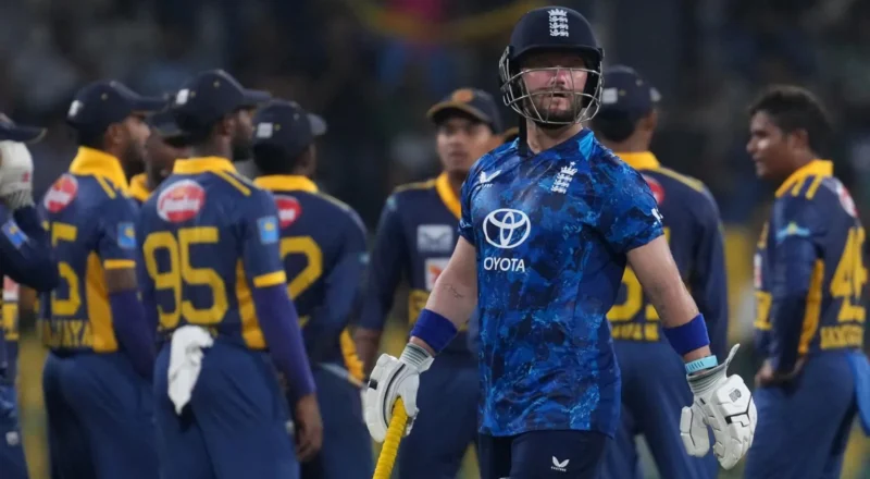 Ben Duckett walks off with celebrating Sri Lanka fielders in the background