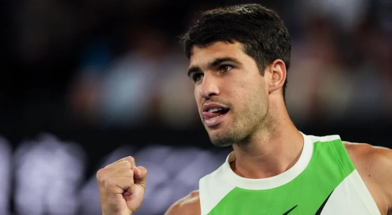Carlos Alcaraz sticks out his tongue in celebration during the 2026 Australian Open final