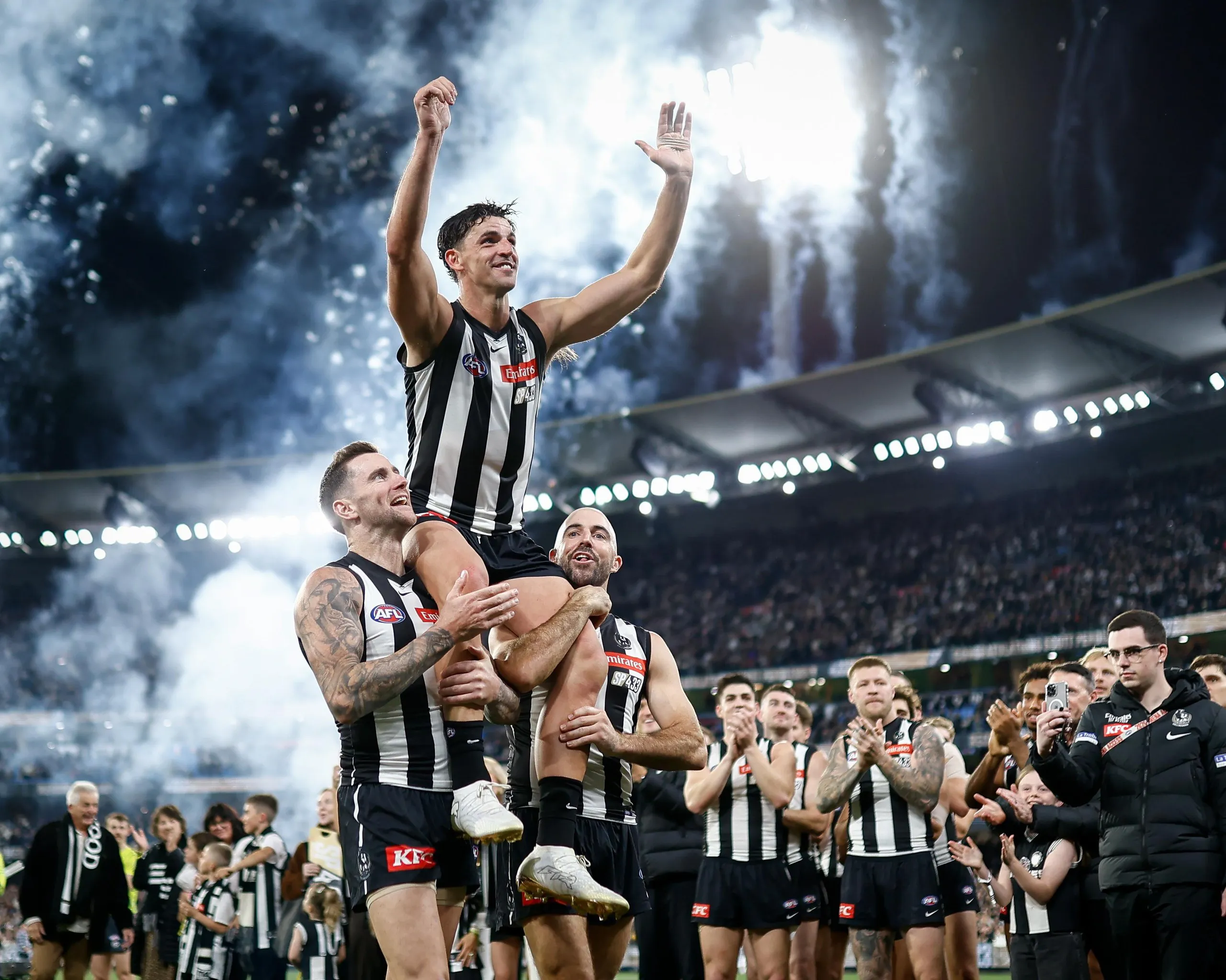 Scott Pendlebury is chaired off the MCG after breaking the VFL/AFL record for 433 games