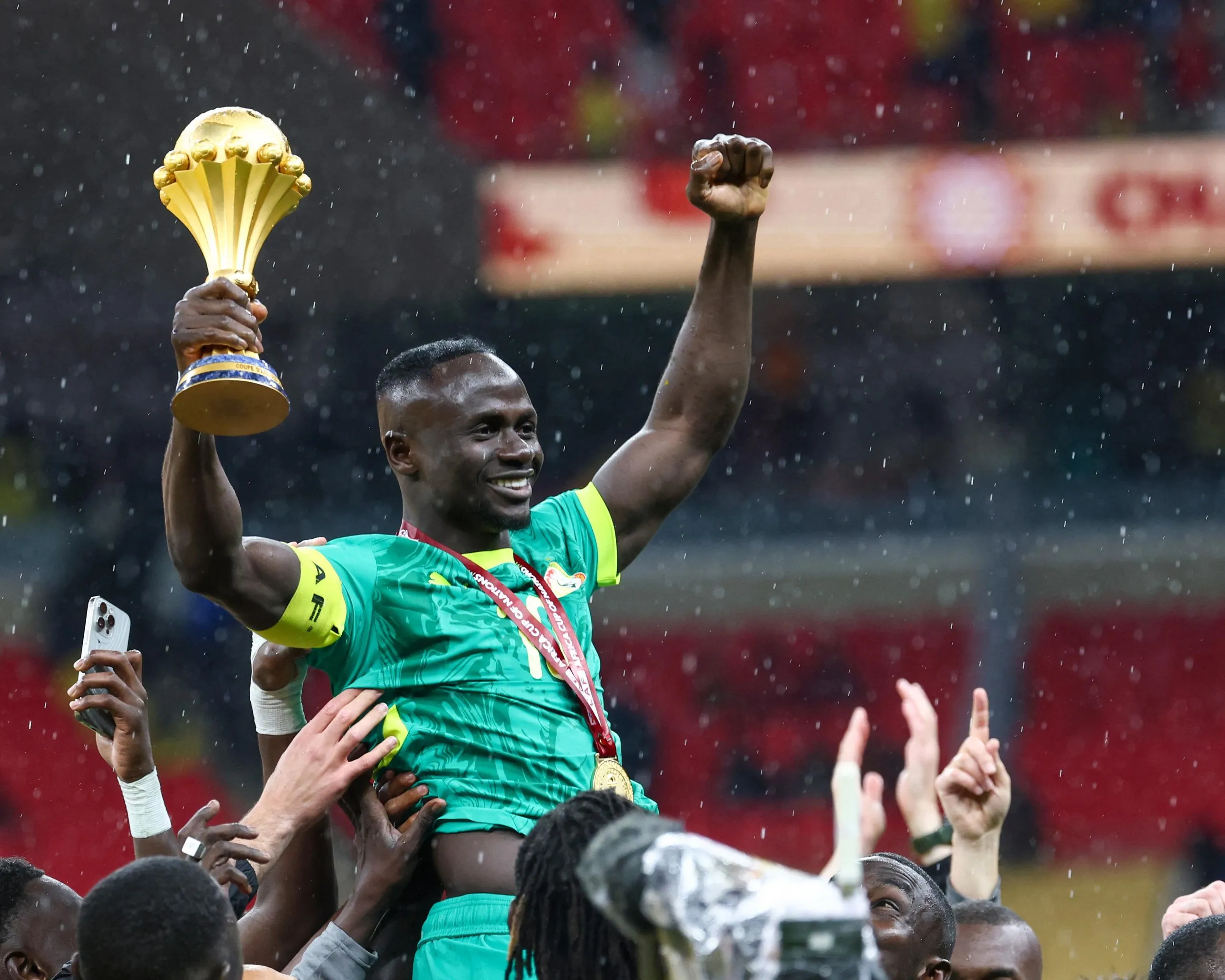 Senegal's Sadio Mane holds up the Afcon trophy, which was subsequently awarded to Morocco.