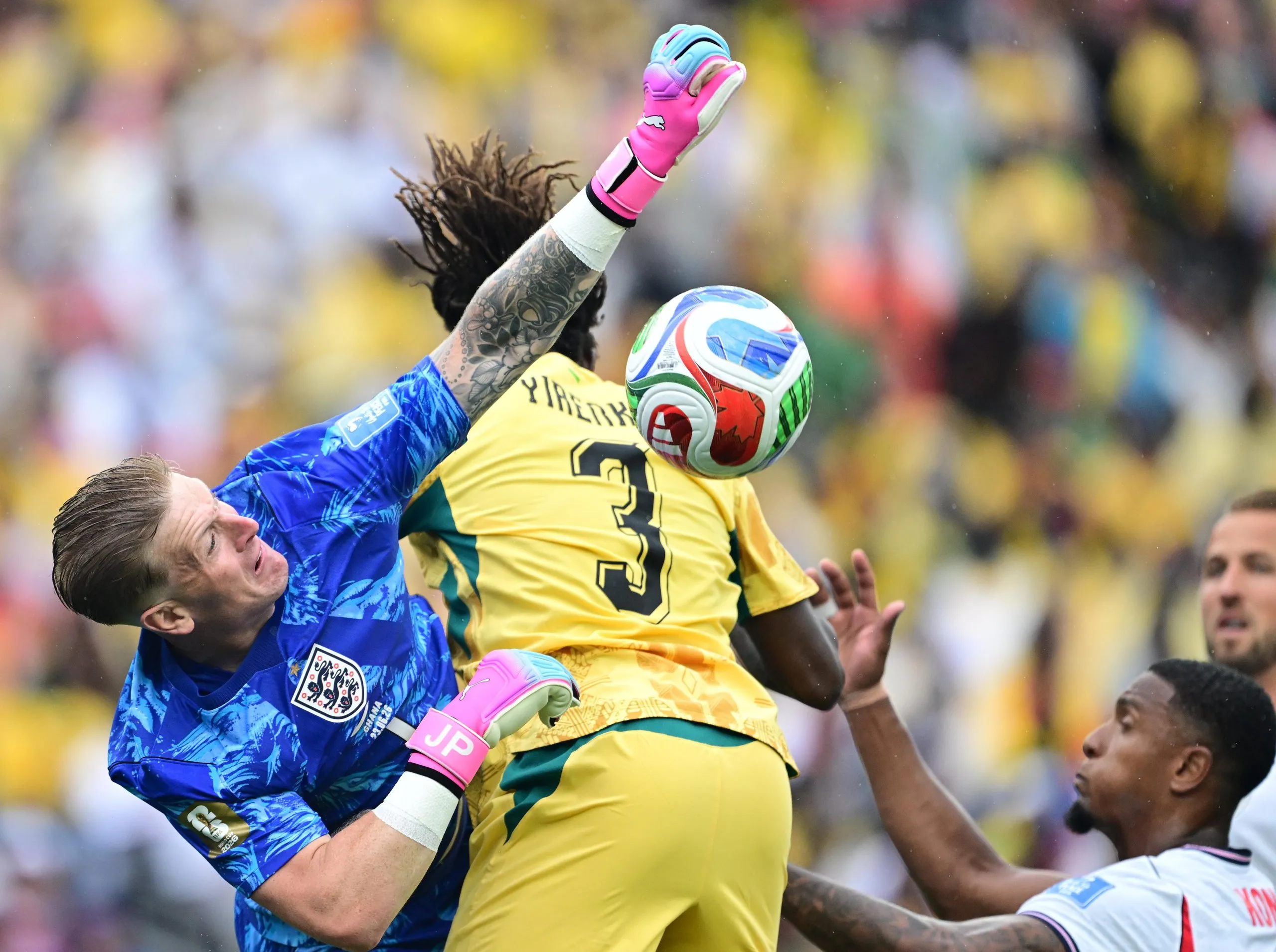 Jordan Pickford comes to punch the ball.