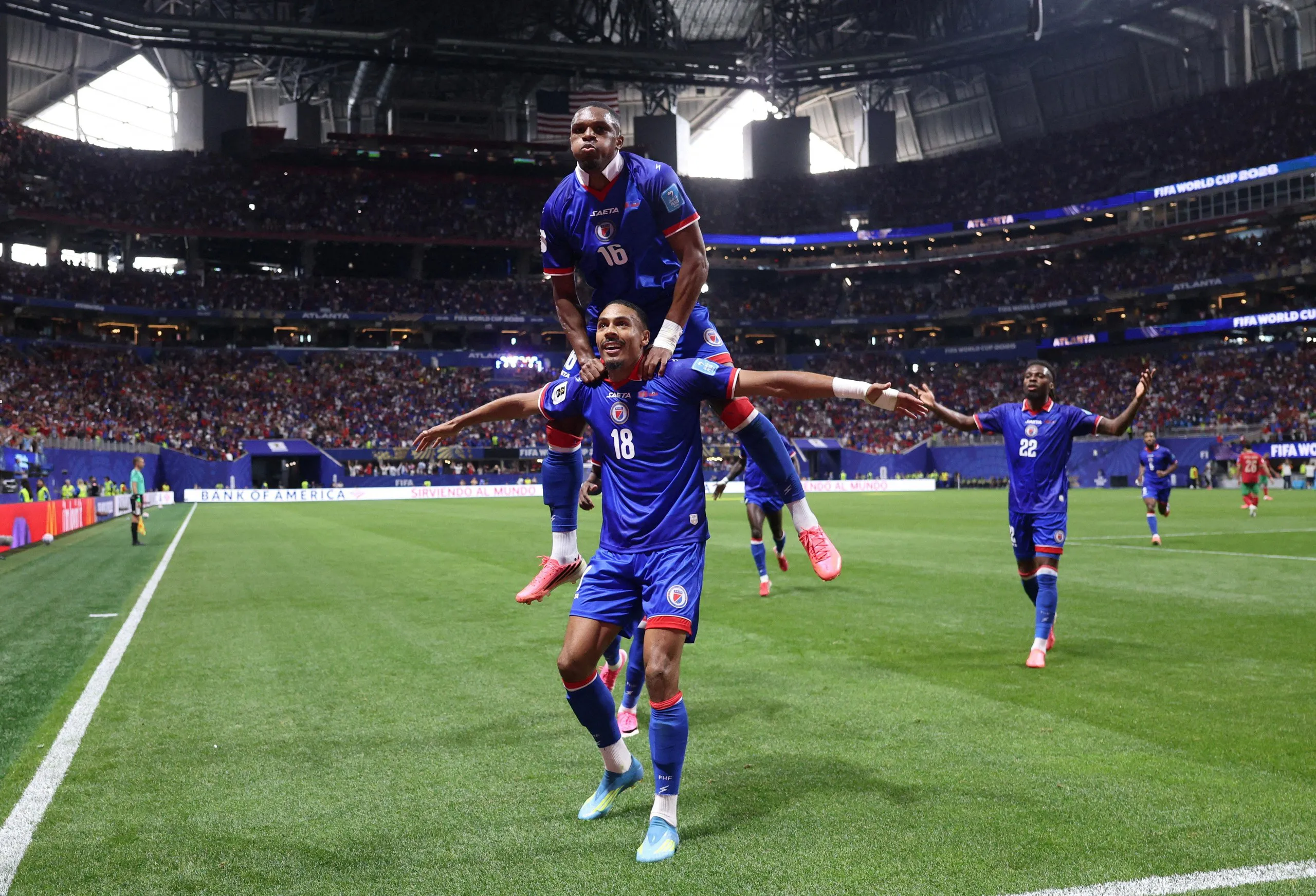 Haiti’s Wilson Isidor celebrates scoring their second goal with Lenny Joseph.