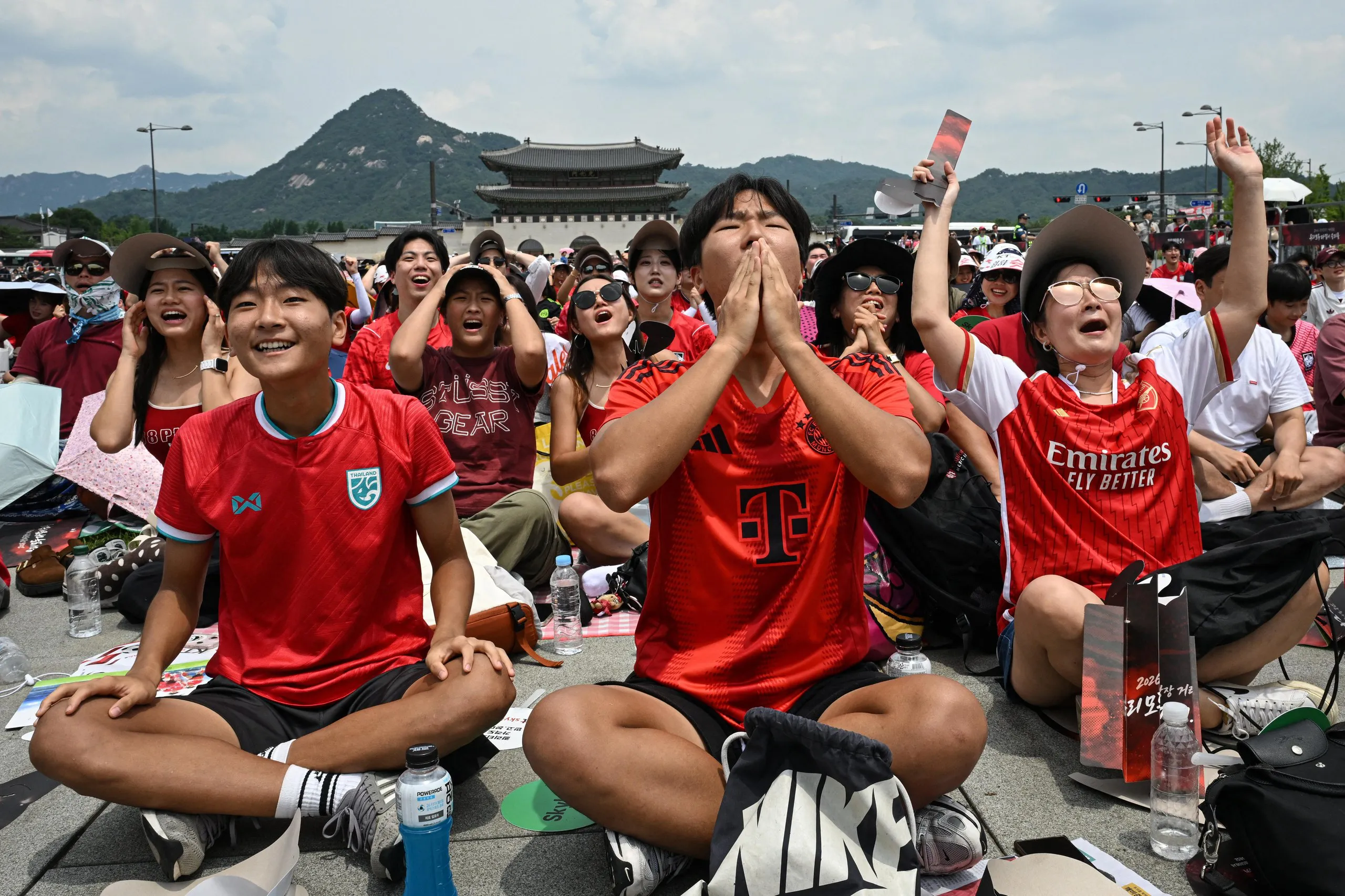 South Korean fans at Gwanghwamun Square in Seoul react as they watch the match between South Korea and Mexico on big screens.