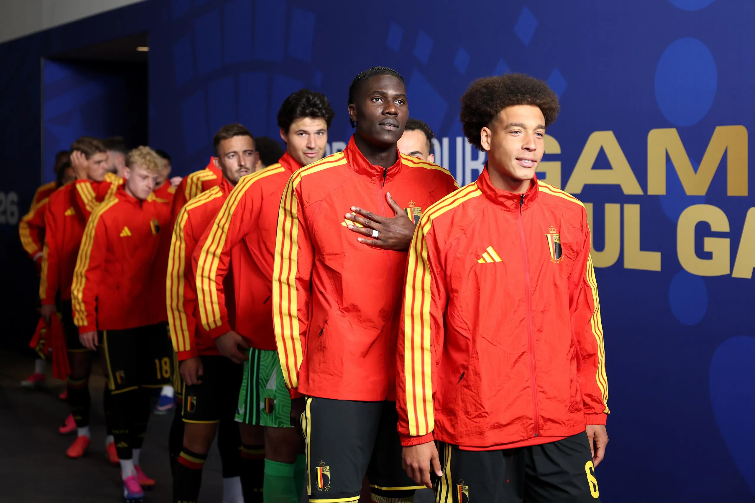 Axel Witsel leads the Belgium players in the tunnel.