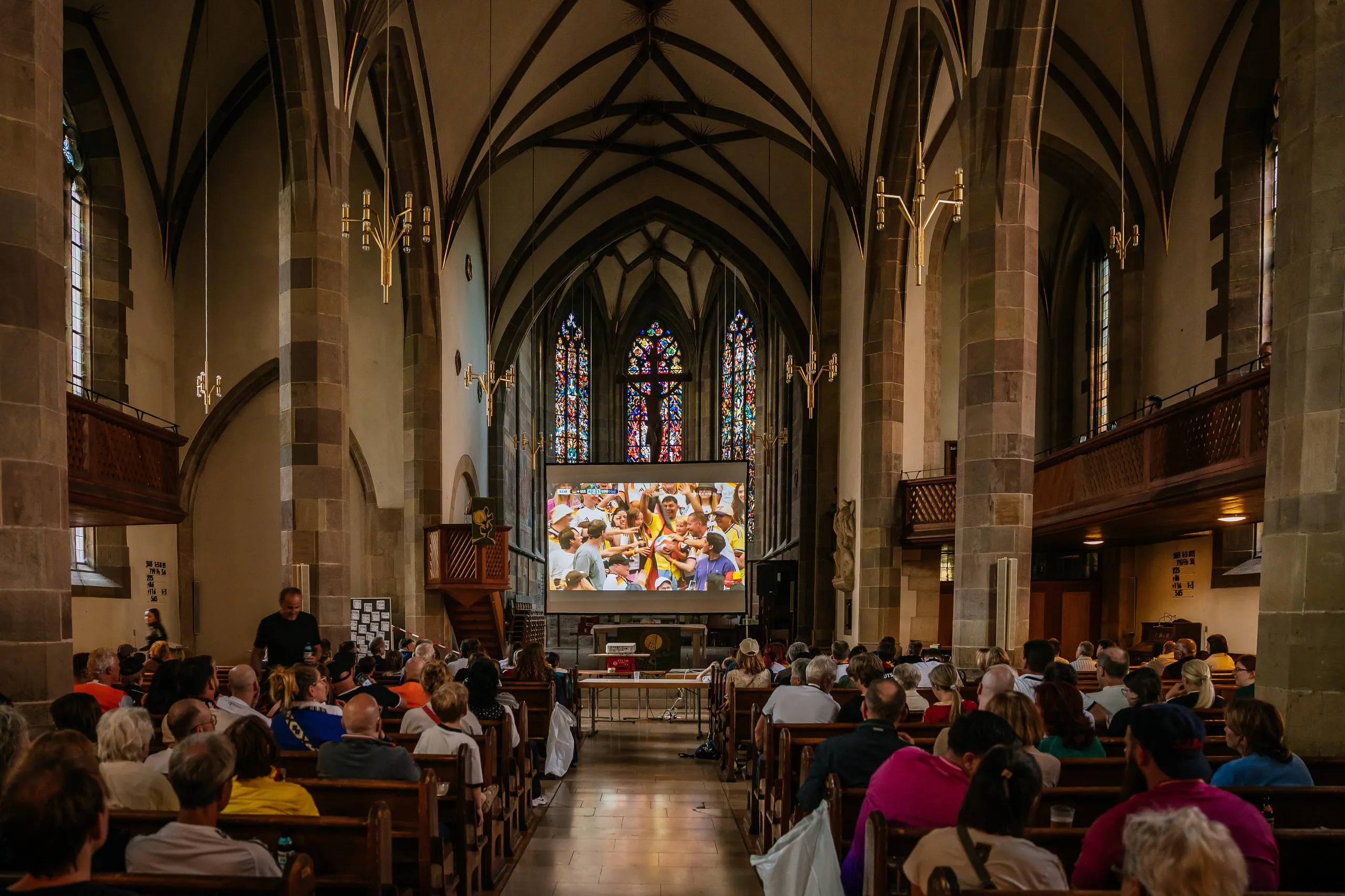 Football fans watch the FIFA World Cup 2026 Group E match between Germany and Curacao at a church in Bad Cannstatt on June 14, 2026 in Stuttgart