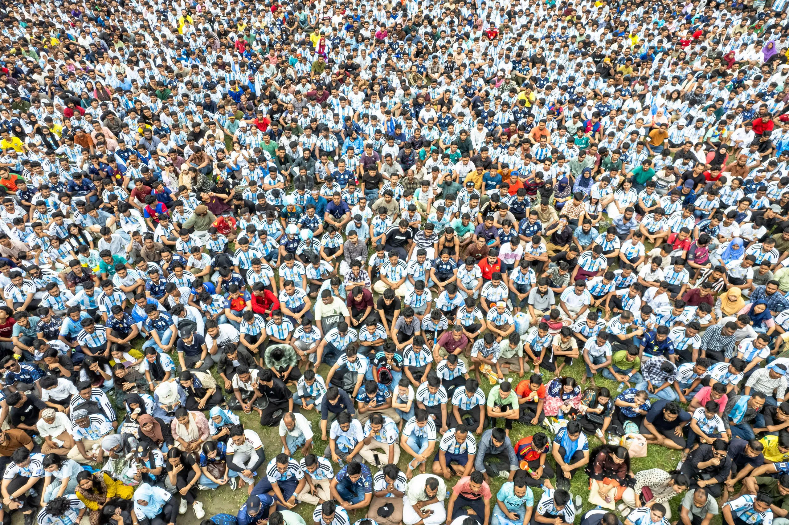 Argentina fans in Dhaka watch the match between Argentina and Algeria on a giant screen.
