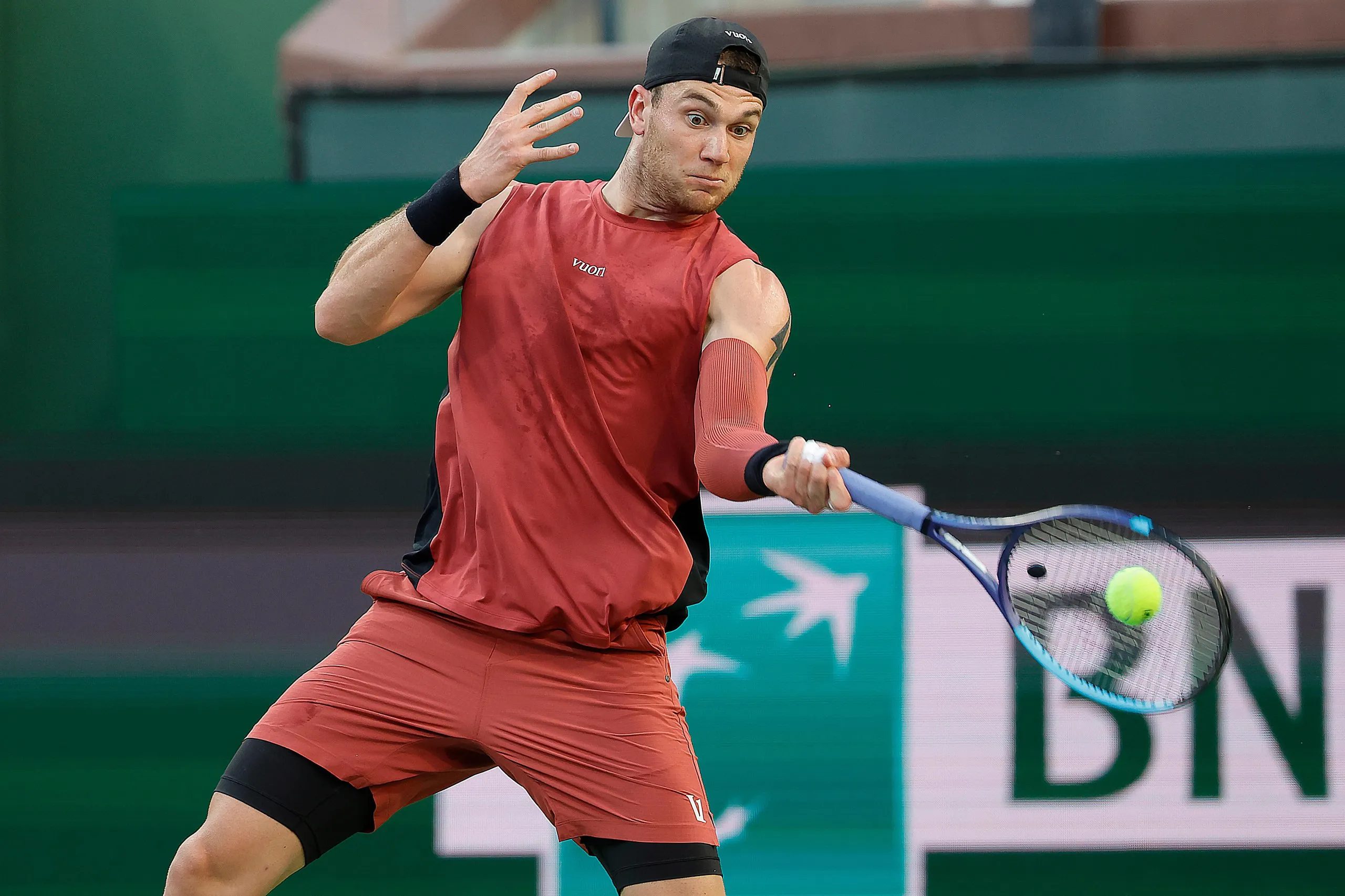 Jack Draper returns the ball during his quarter-final against Daniil Medvedev at Indian Wells