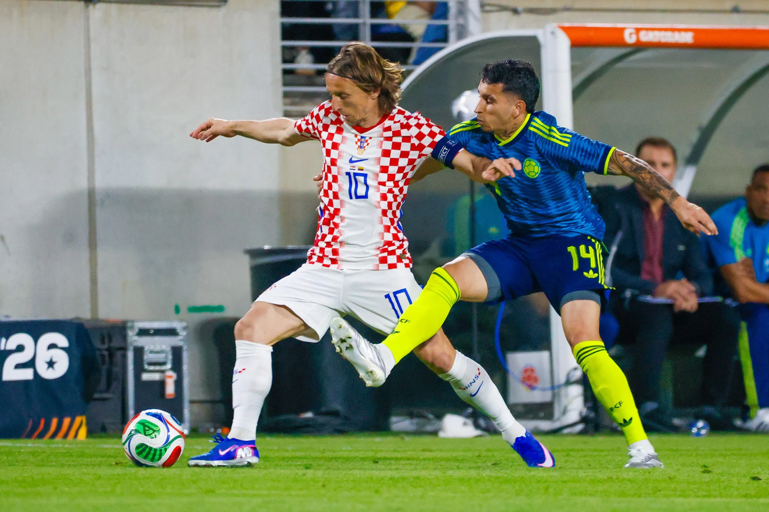 Luka Modric holds off an opponent.