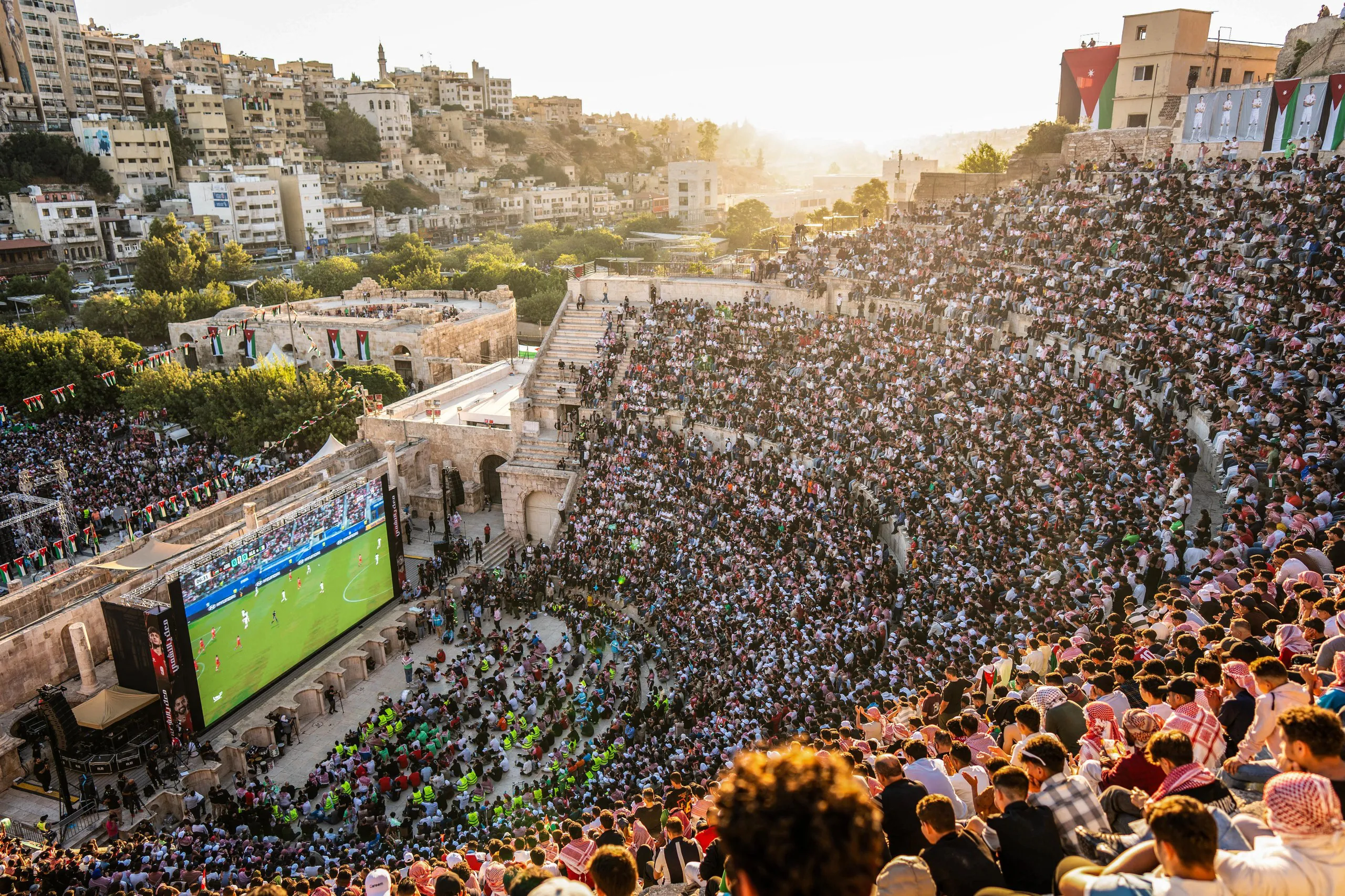 Jordanian football fans gather at the second-century Roman amphitheatre in the capital, Amman, to watch their national team’s group match against Algeria.