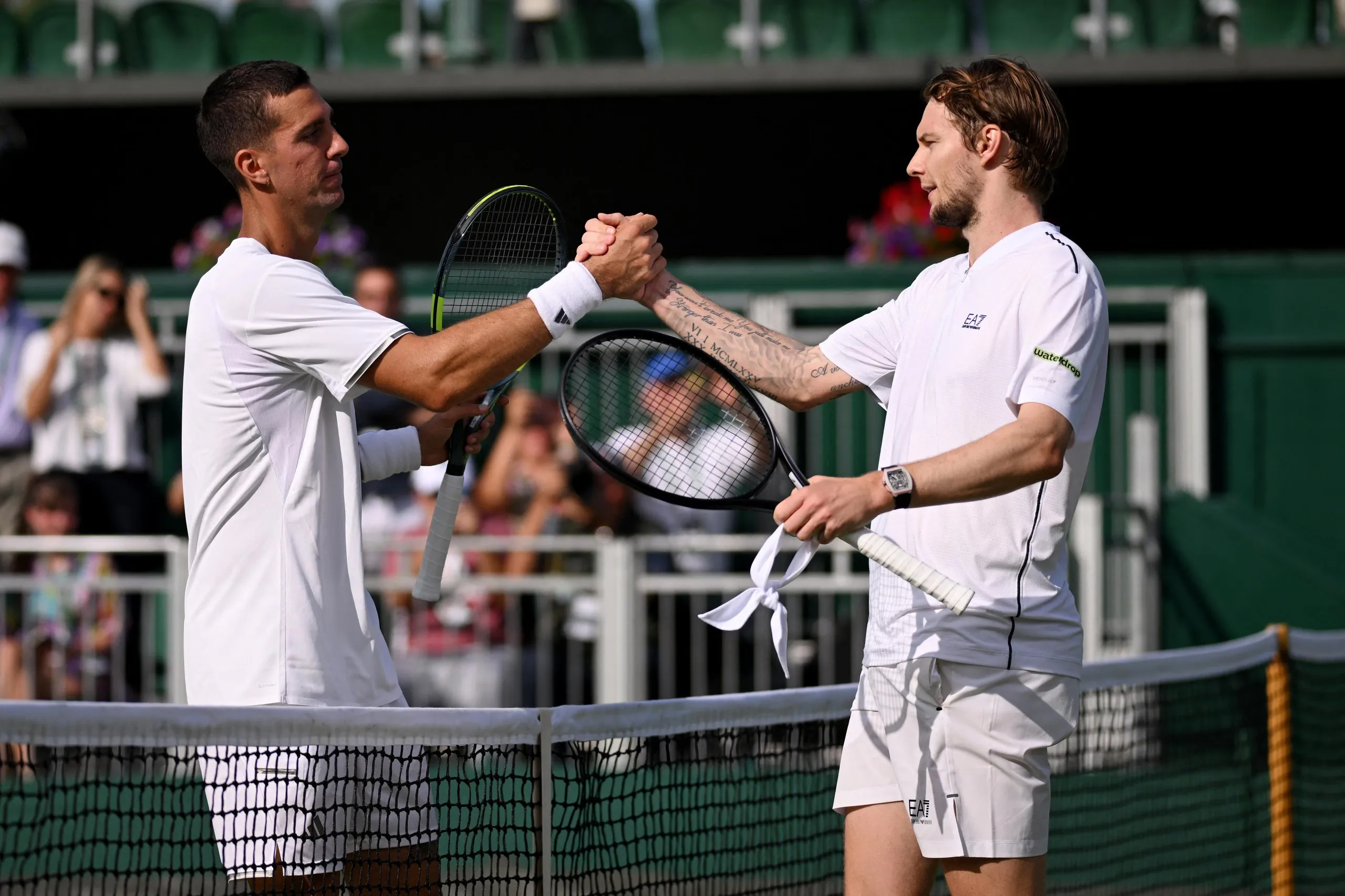 Thanasi Kokkinakis, left, lost 4-6 6-3 7-6 (12-10) 6-3 6-4 to Alexandre Bublik