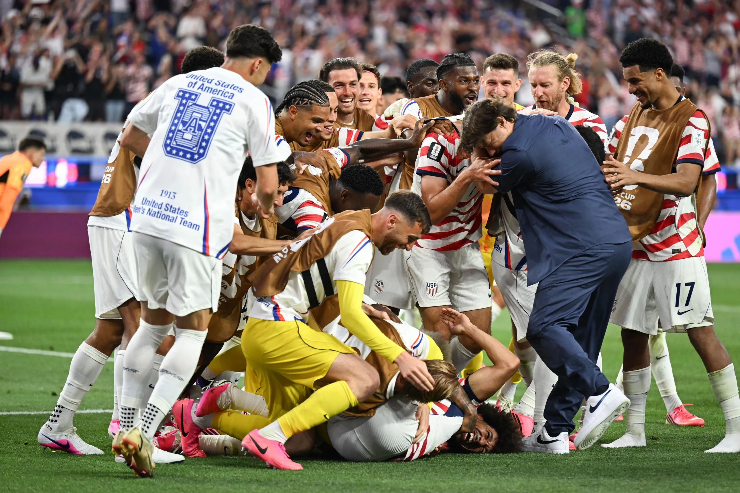 Giovanni Reyna #7 of United States celebrates scoring with teammates and United States head coach Mauricio Pochettino during the second half against Paraguay during a FIFA World Cup 2026 Group D match at Los Angeles Stadium on June 12, 2026 in Los Angeles, California.