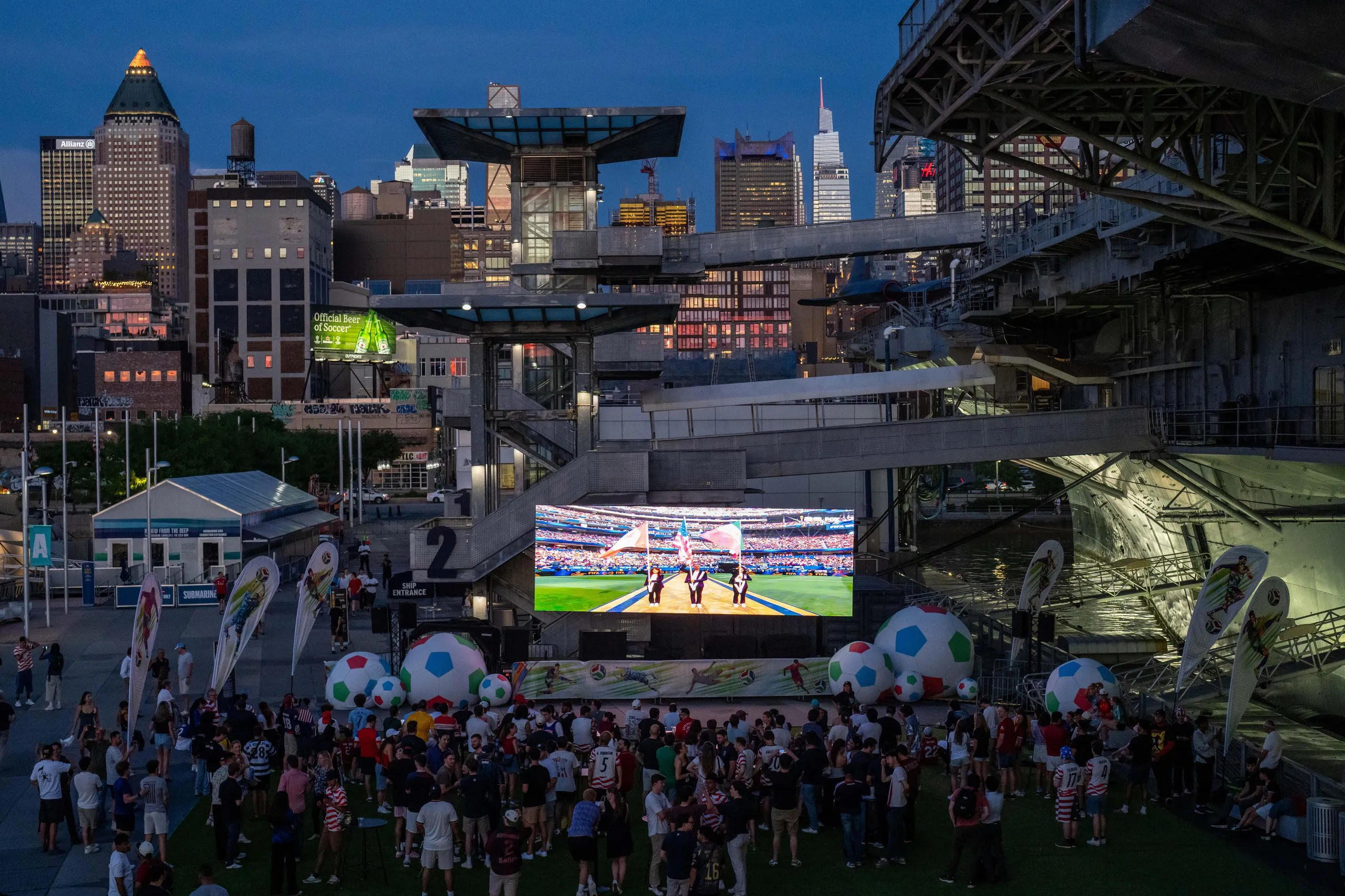 People attend a watch party for the game between USA and Paraguay at Intrepid Museum in New York.