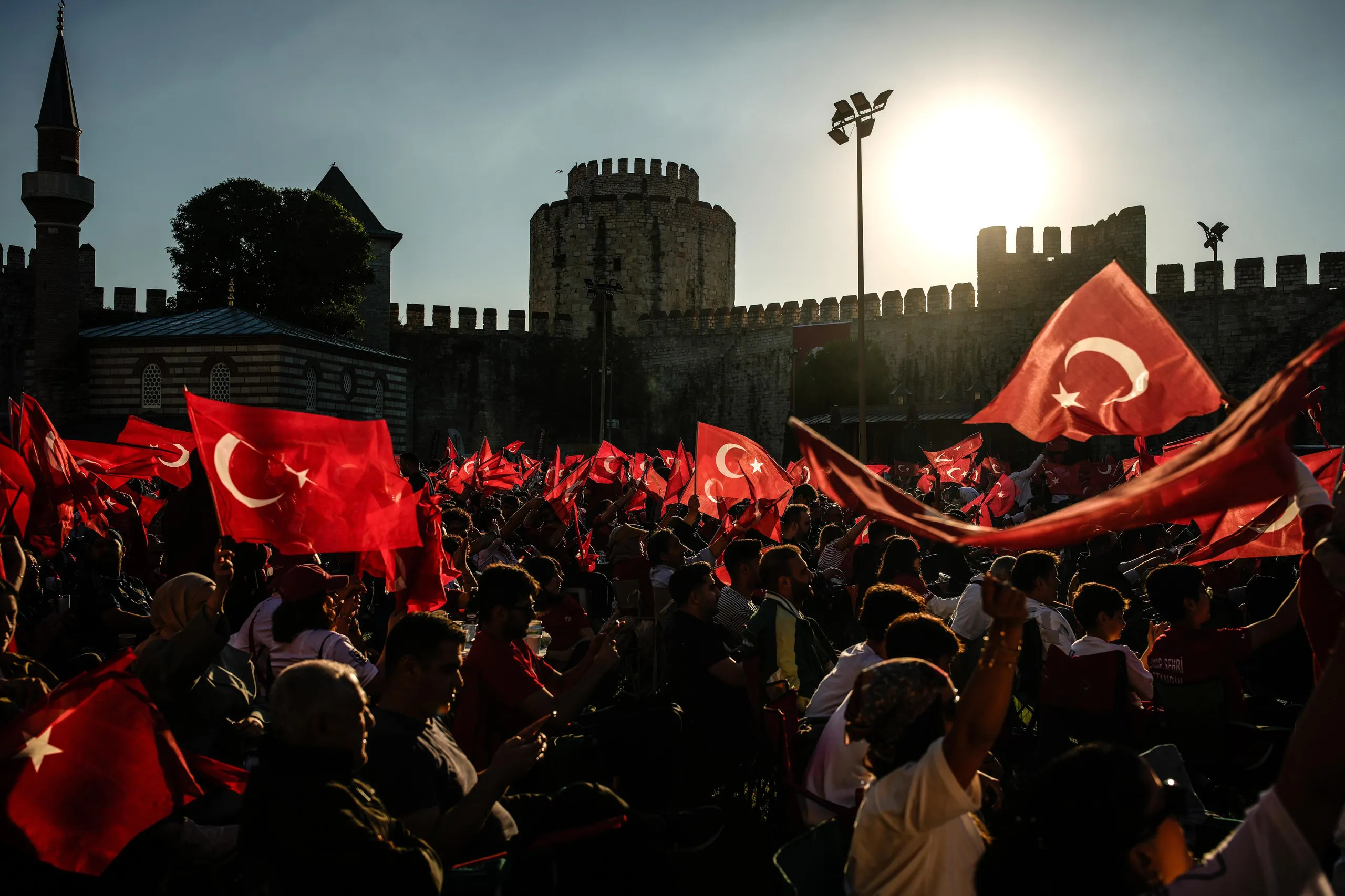 Turkish fans at the historic Yedikule fortress in Istanbul revel while watching a giant screen of the Group D match between Australia and Turkey.