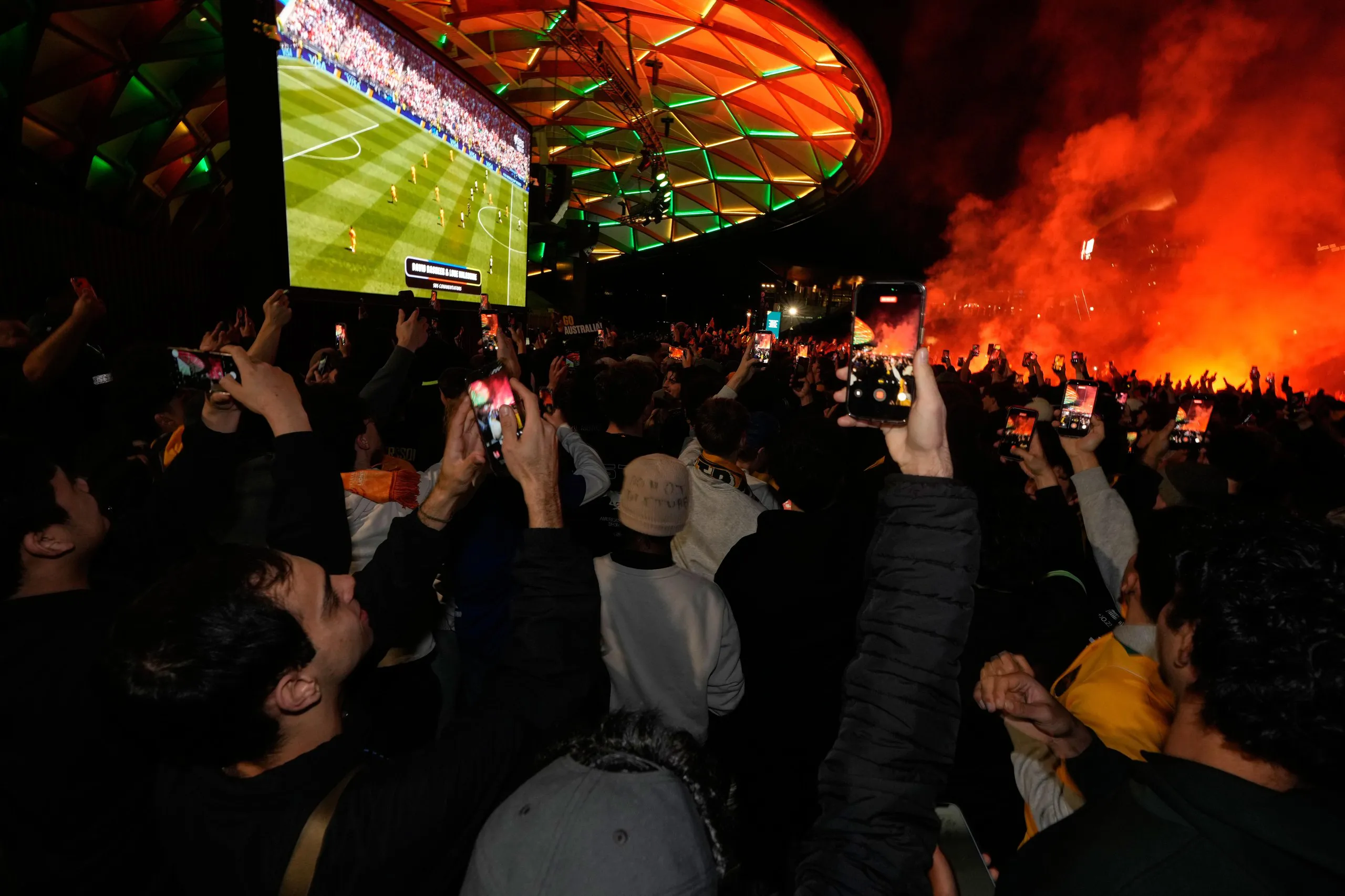 Australian fans watching on large screens in a park in Sydney as their team play USA.
