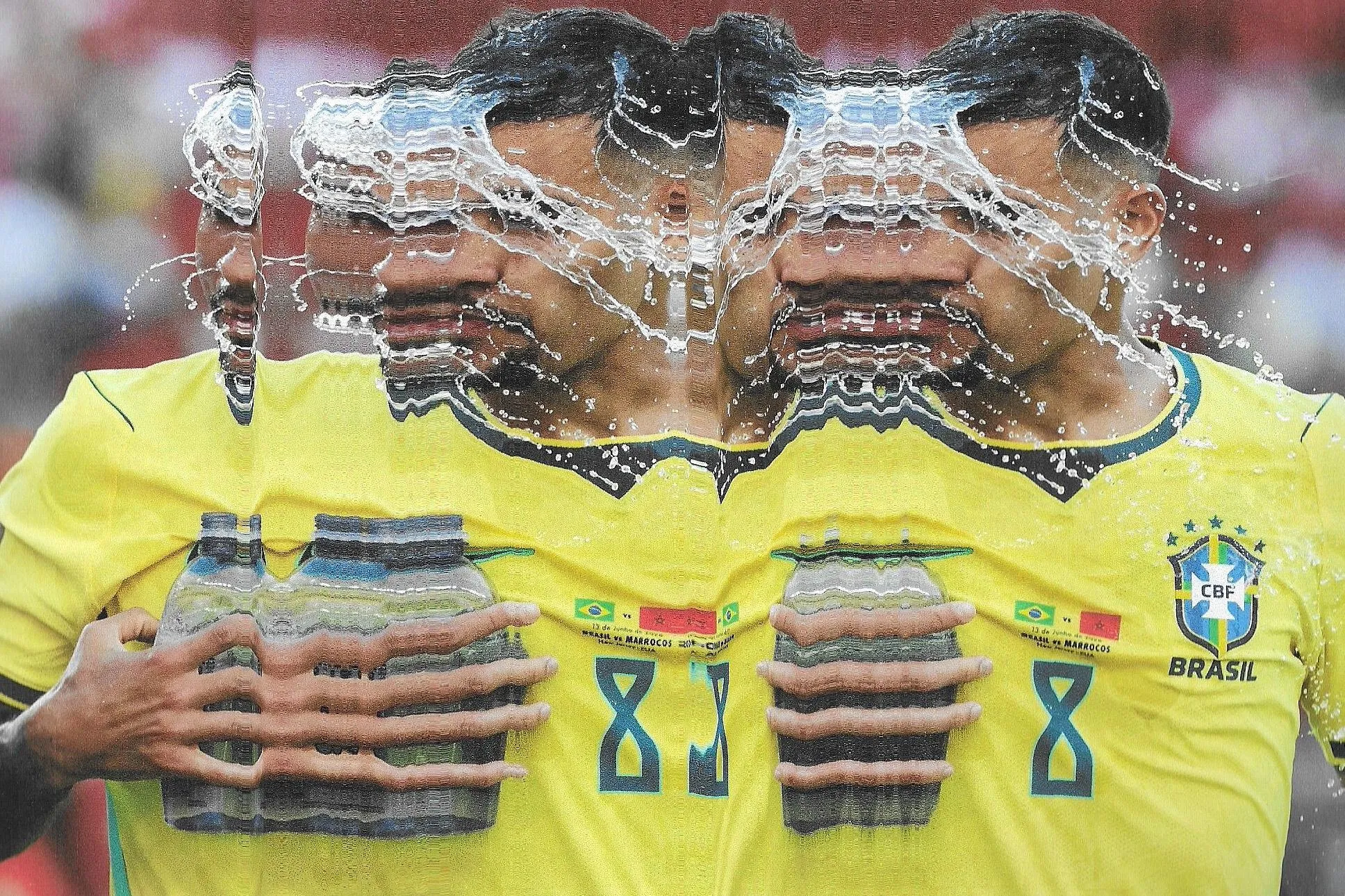 Bruno Guimarães pours water on to his face. Original photograph by Adam Hunger.