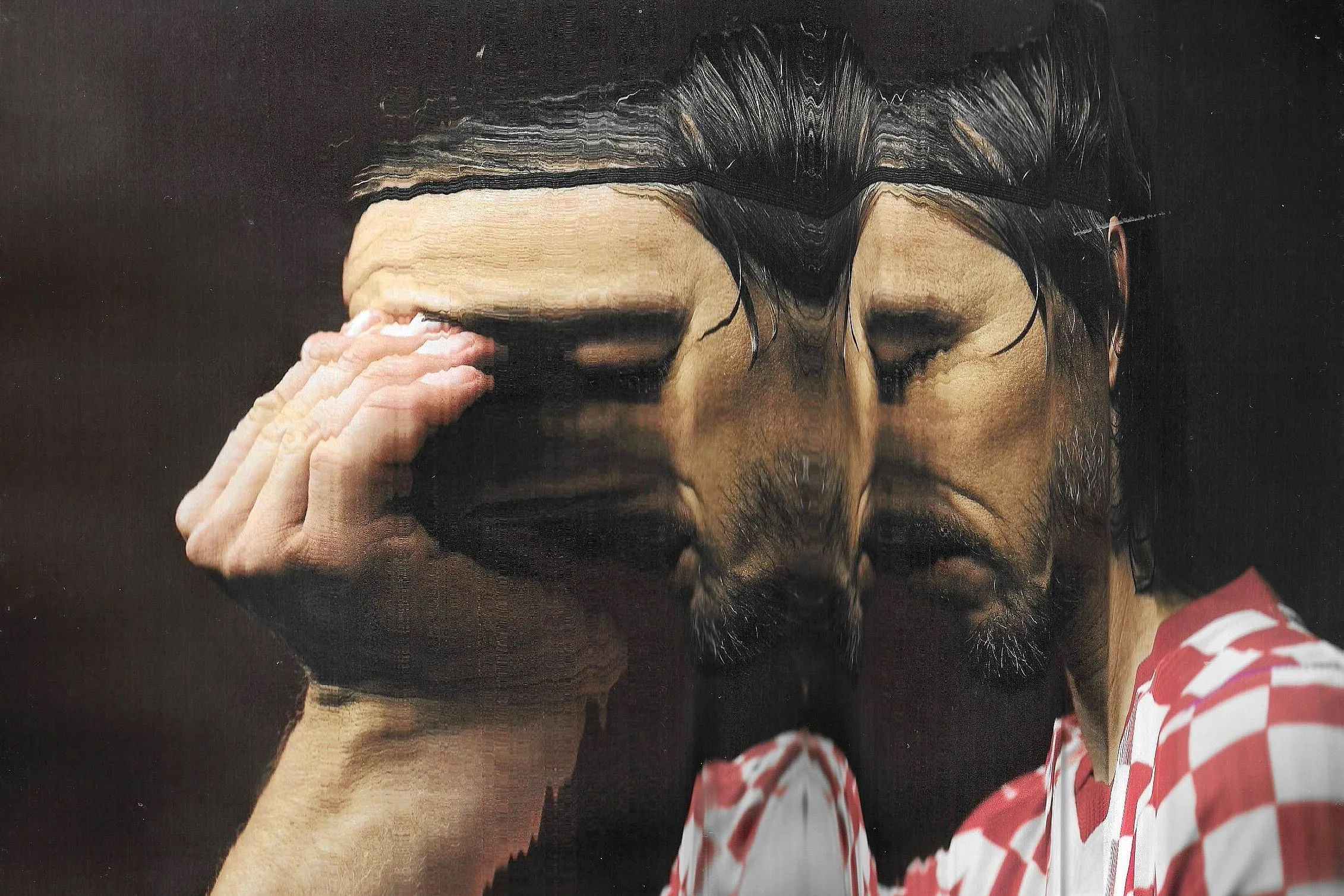 Luka Modric deep in thought. Original photograph by Joosep Martinson.