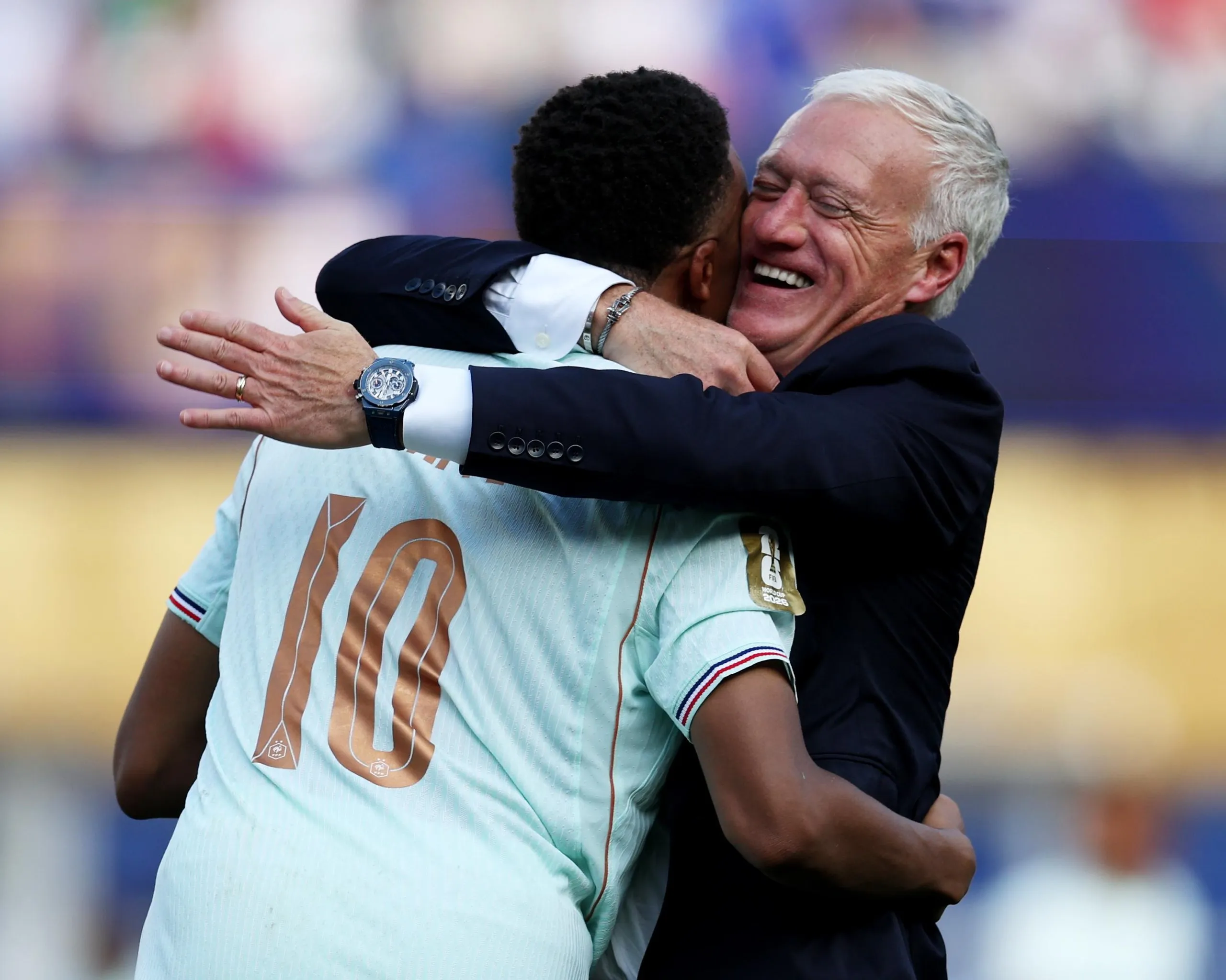 Didier Deschamps and Kylian Mbappé hug after France’s win over Morocco