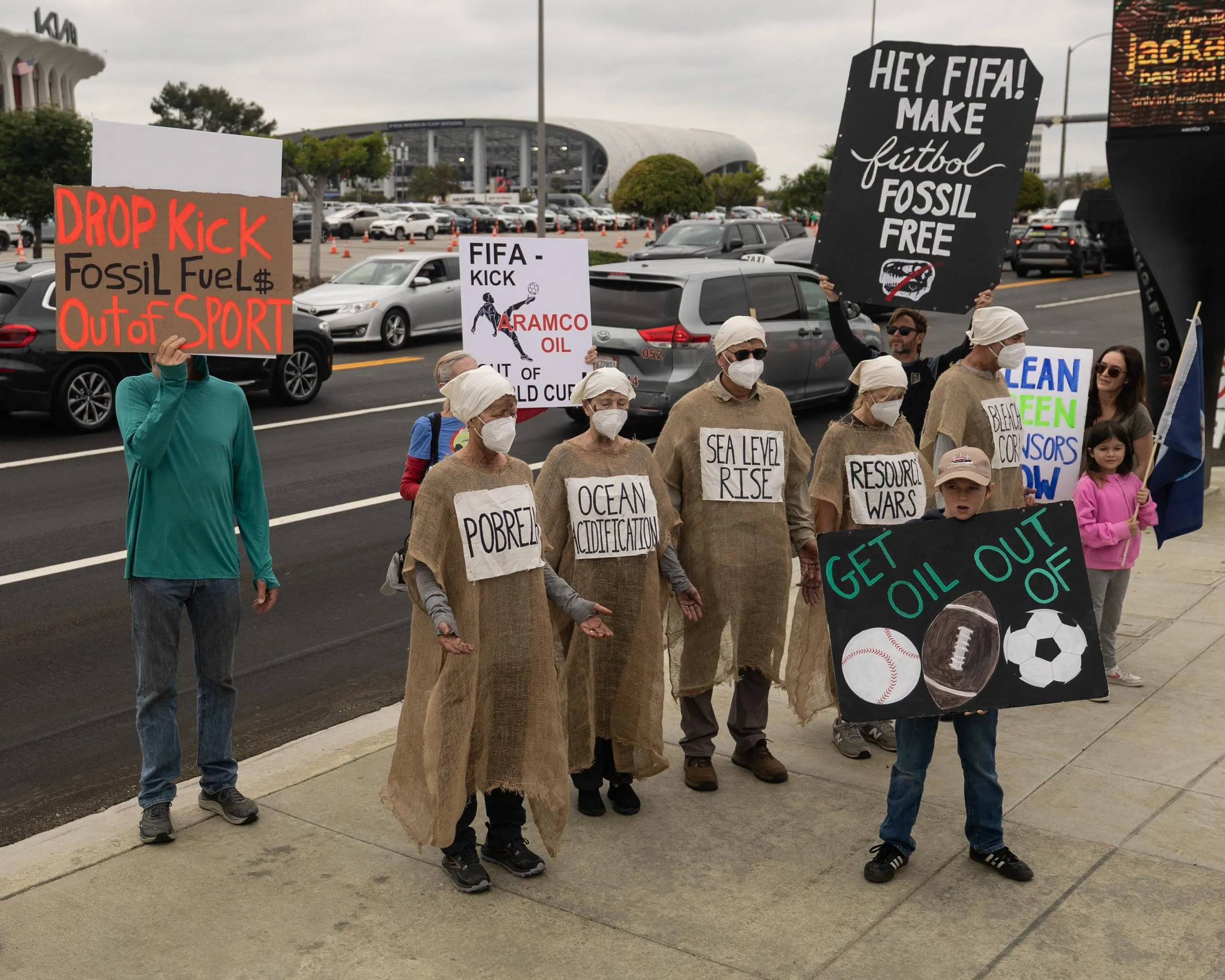 Demonstrators take to the streets outside Los Angeles Stadium to protest against Aramco in the run up to the World Cup group match between Belgium and Iran. Activists are urging Fifa to drop the Saudi oil company as a sponsor.