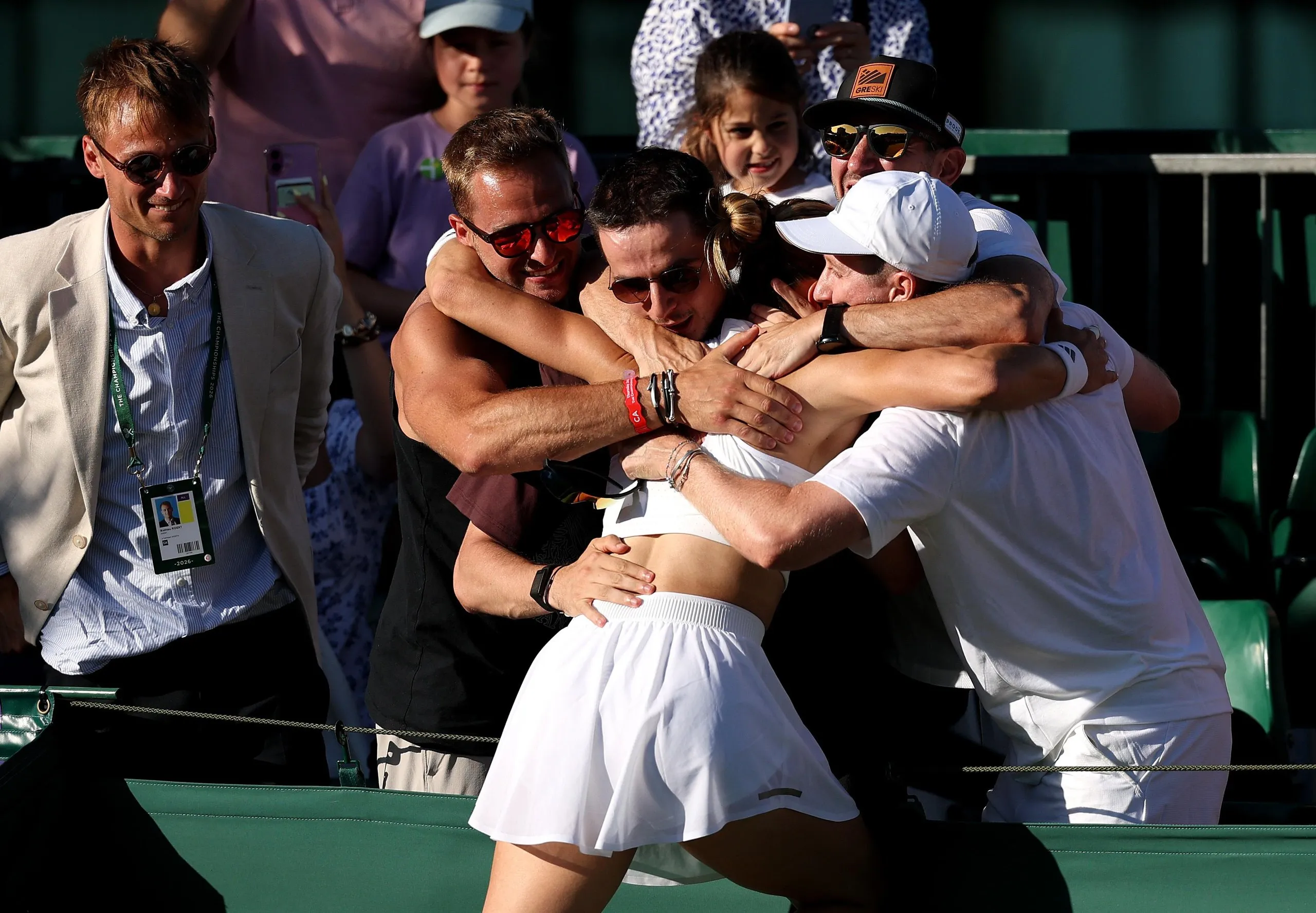 Maria Sakkari celebrates with her team including partner Konstantinos Mitsotakis after victory against Kamilla Rakhimova.