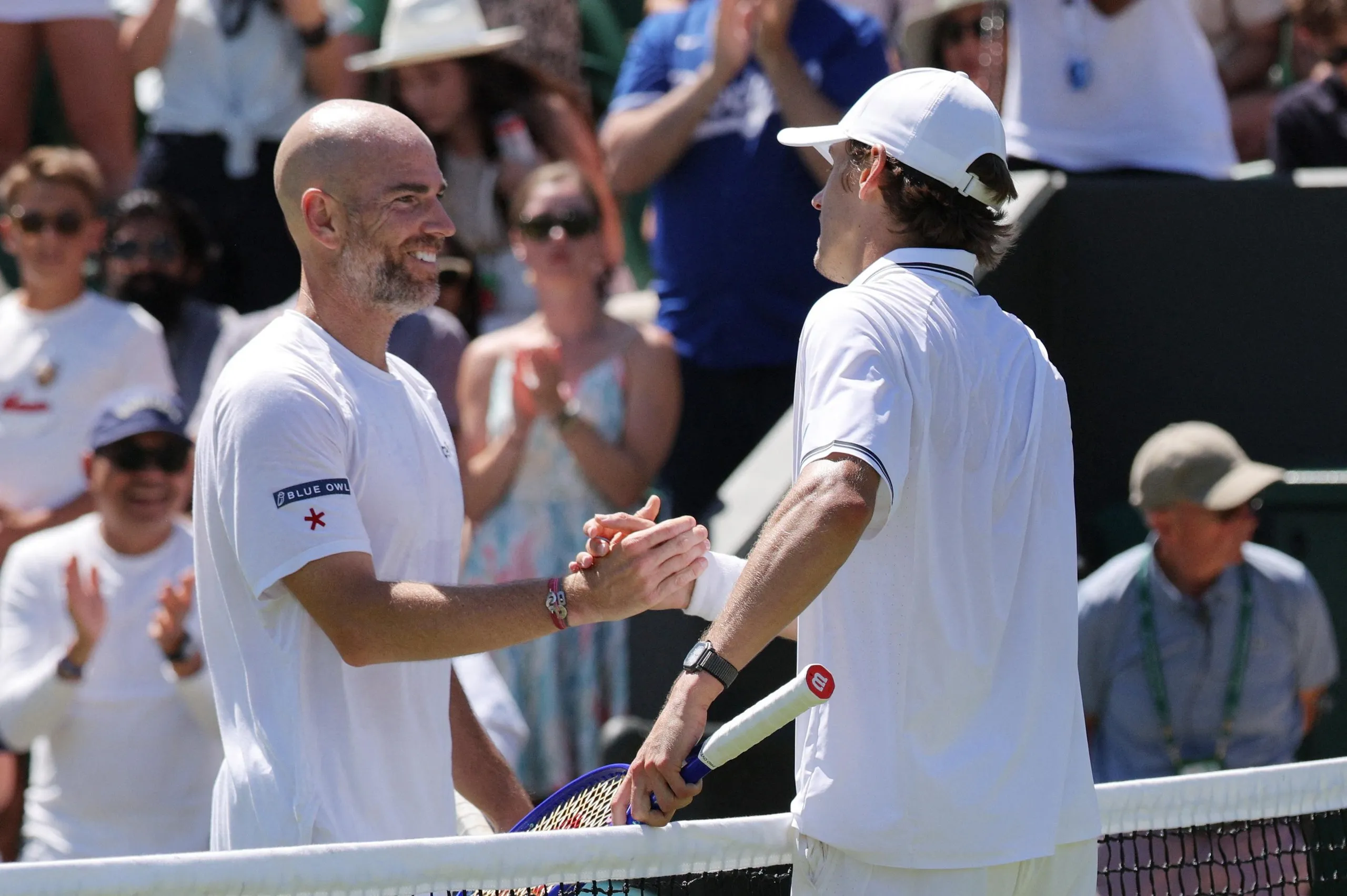 Alex de Minaur shakes hands with France’s Adrian Mannarino after winning their second round match.