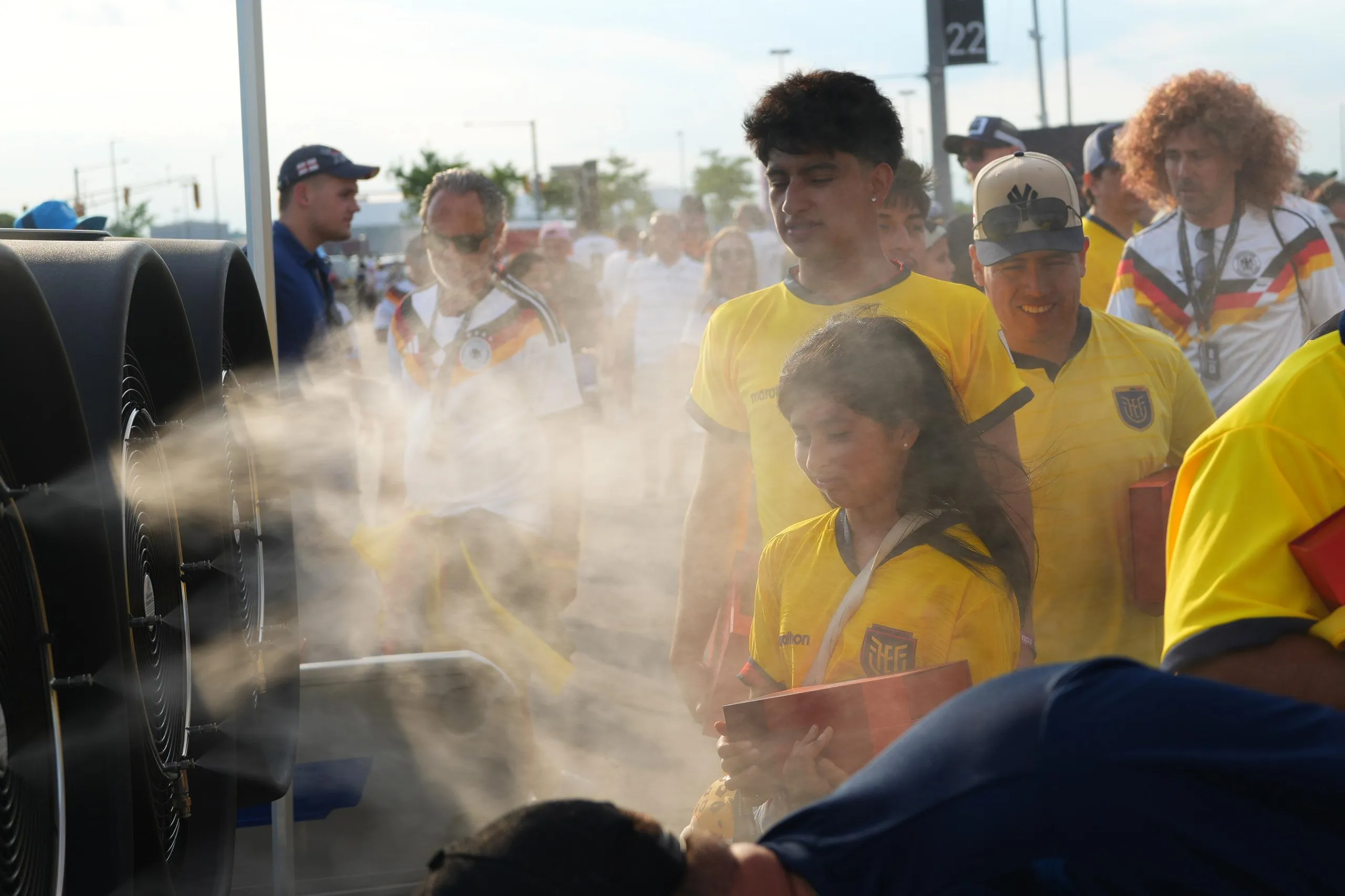 people in front of a fan