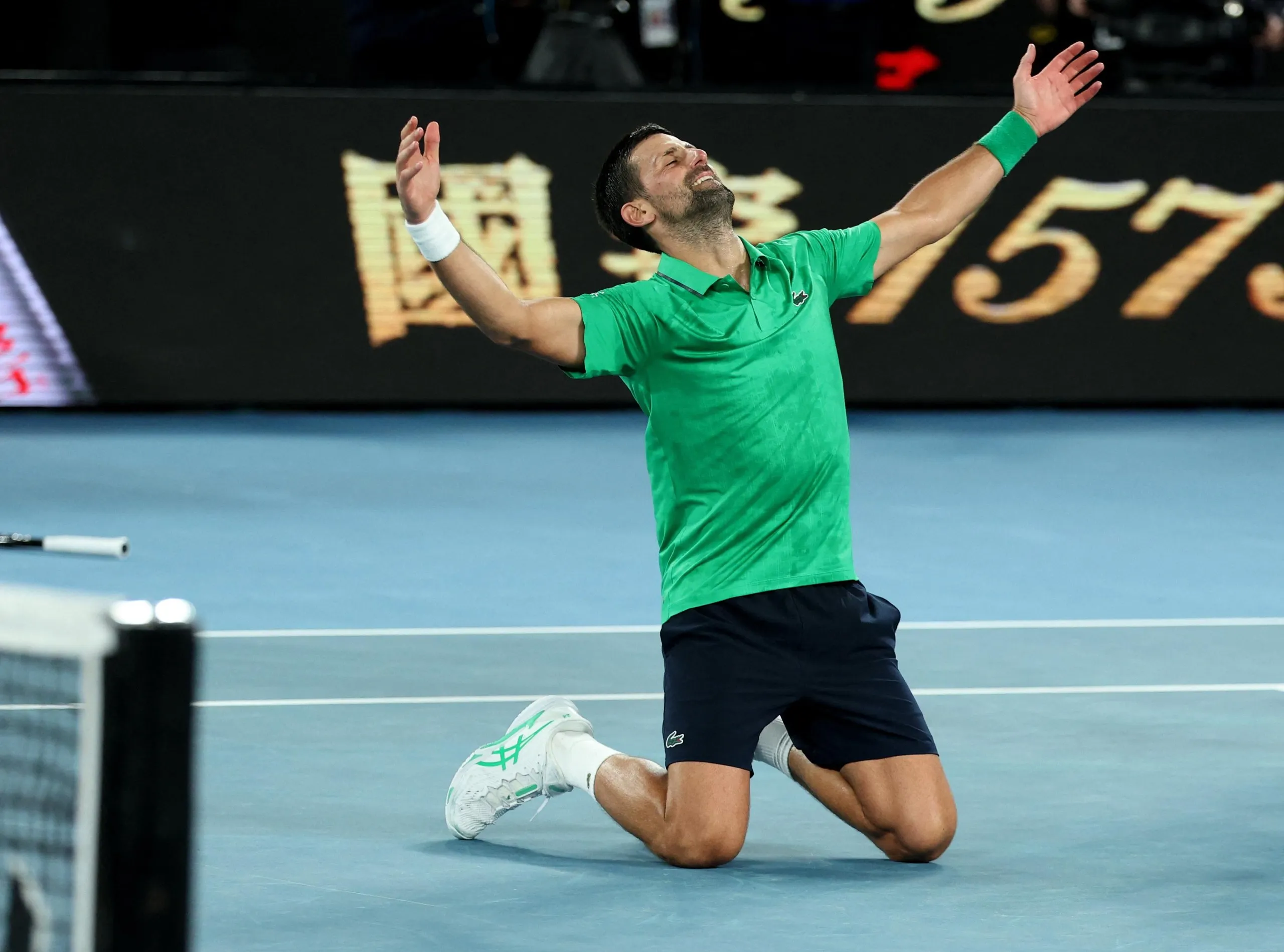 Novak Djokovic celebrates winning his semi final match against Italy's Jannik Sinner at the Australian Open