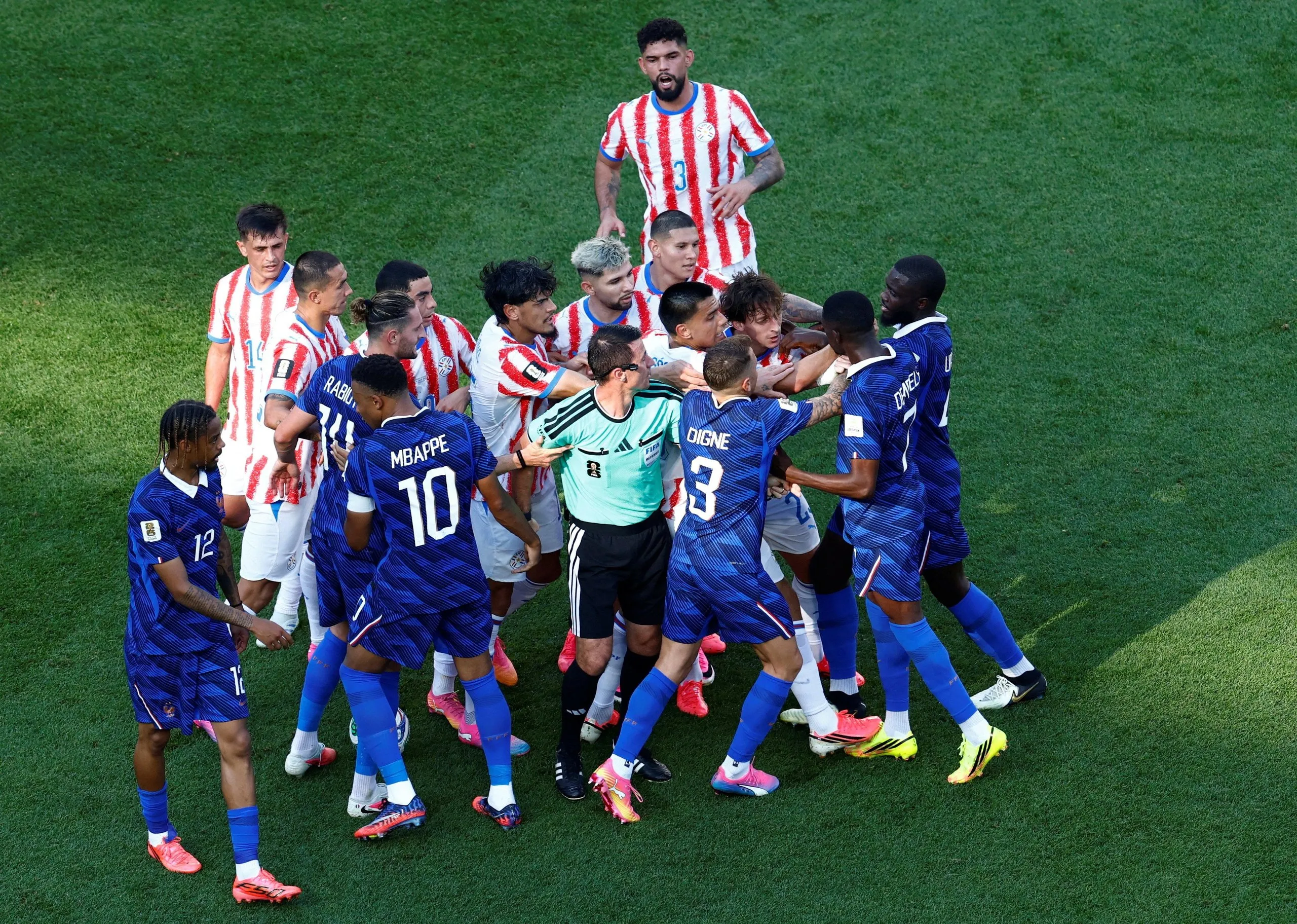 France’s Ousmane Dembélé clashes with Paraguay players after Andrés Cubas fouled Kylian Mbappé
