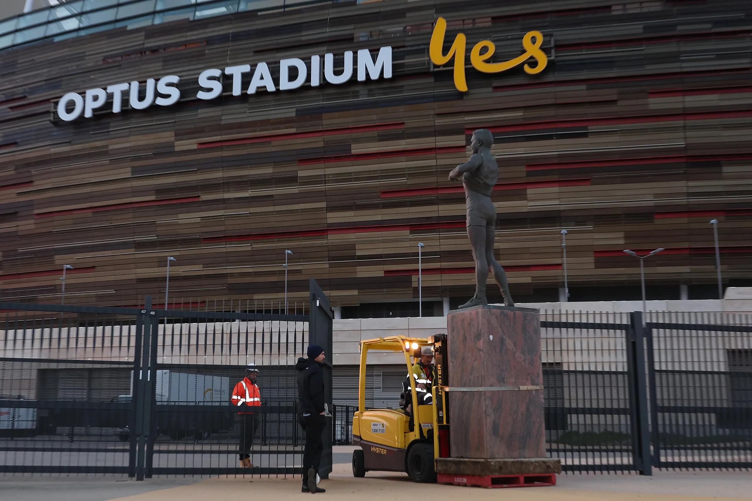 The statue is transported to a storage location after being removed from outside Optus Stadium.