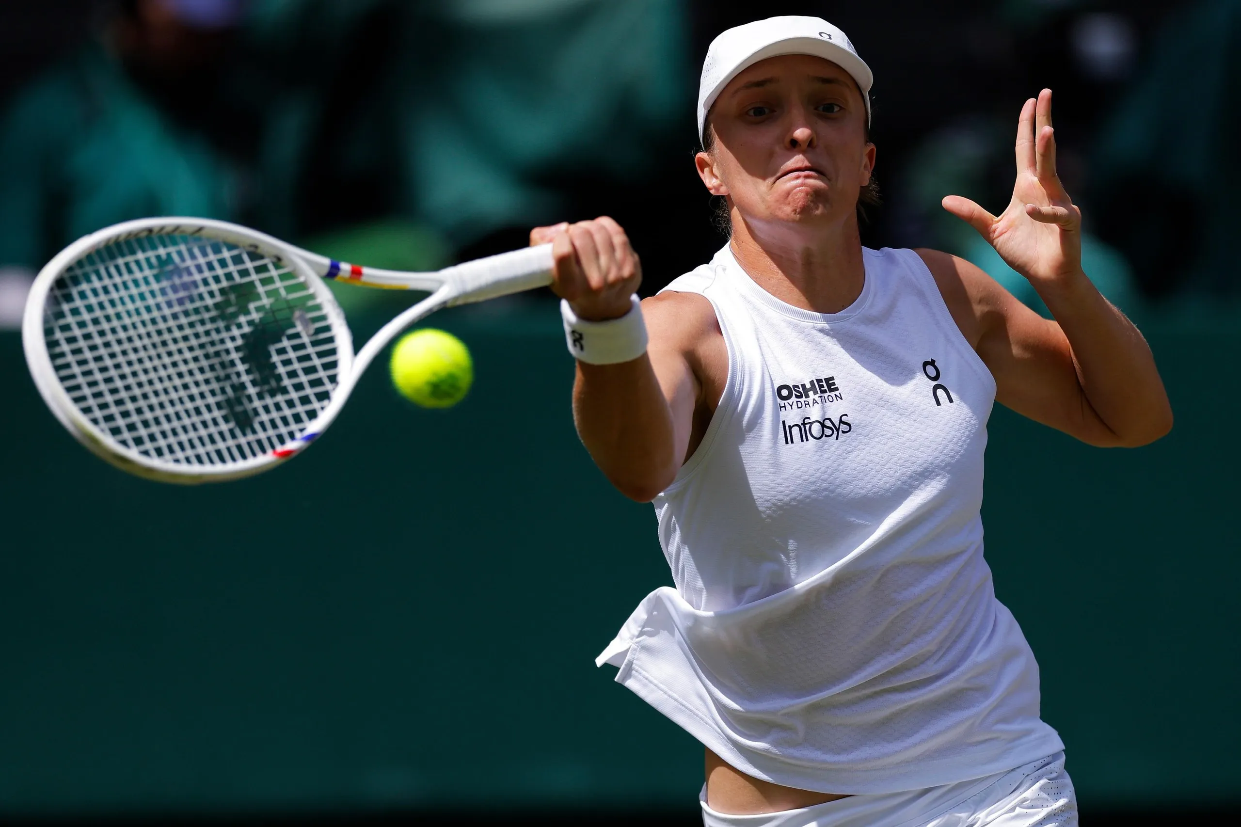 Iga Swiatek fires a forehand to Karolina Pliskova.