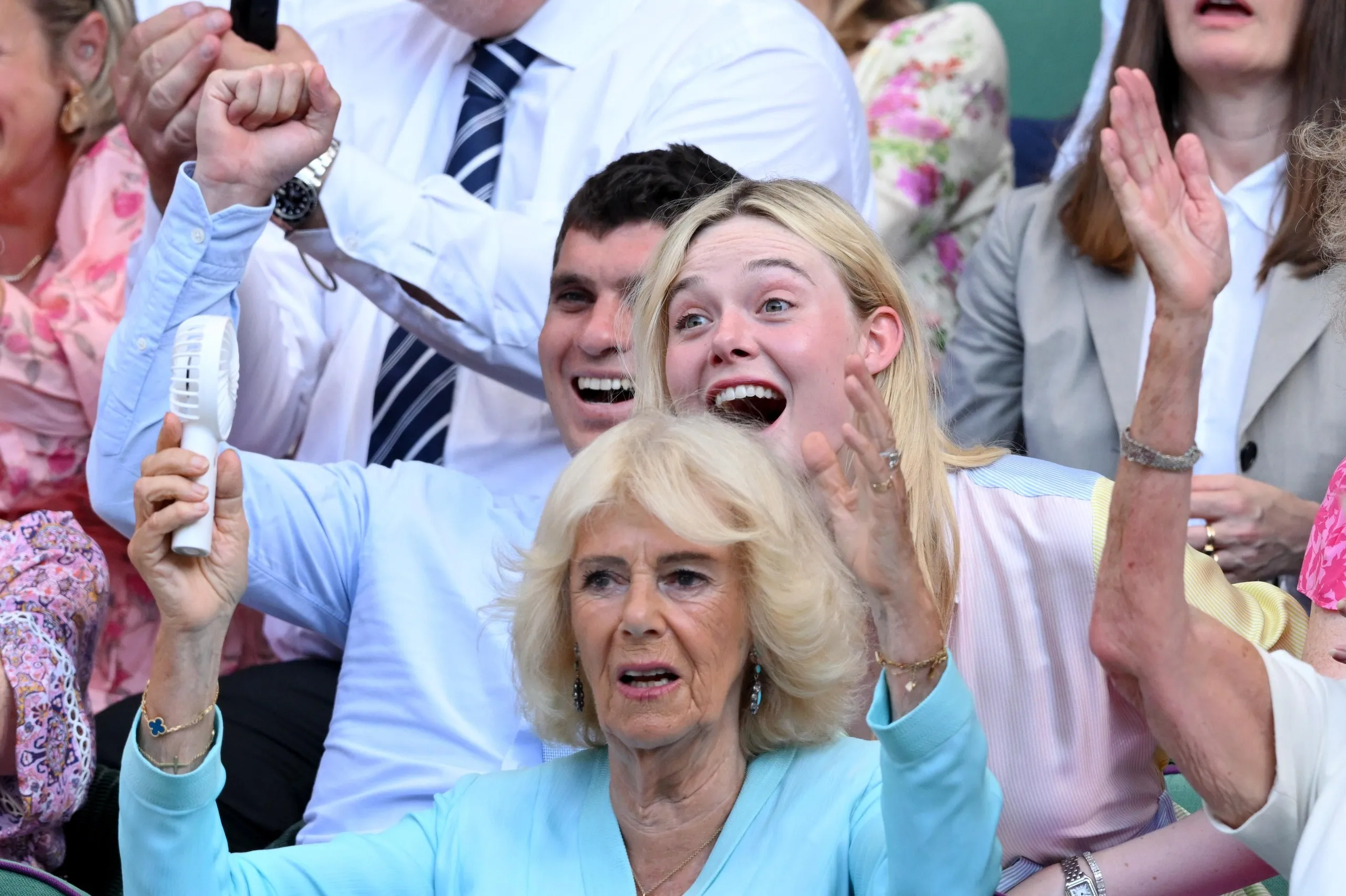 Celebrity spotting is very popular. From left: Gus Wenner, Queen Camilla and Elle Fanning.