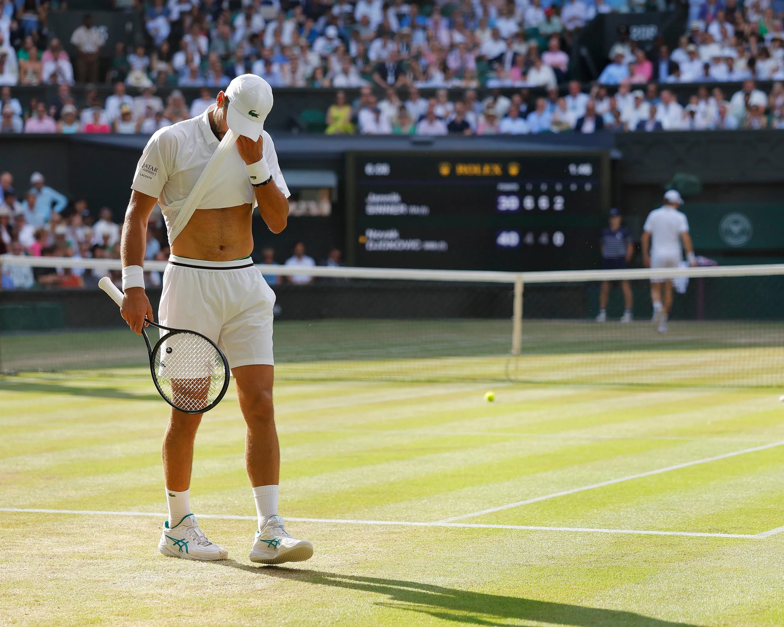 Novak Djokovic feels the heat during a his semi-final against Jannik Sinner