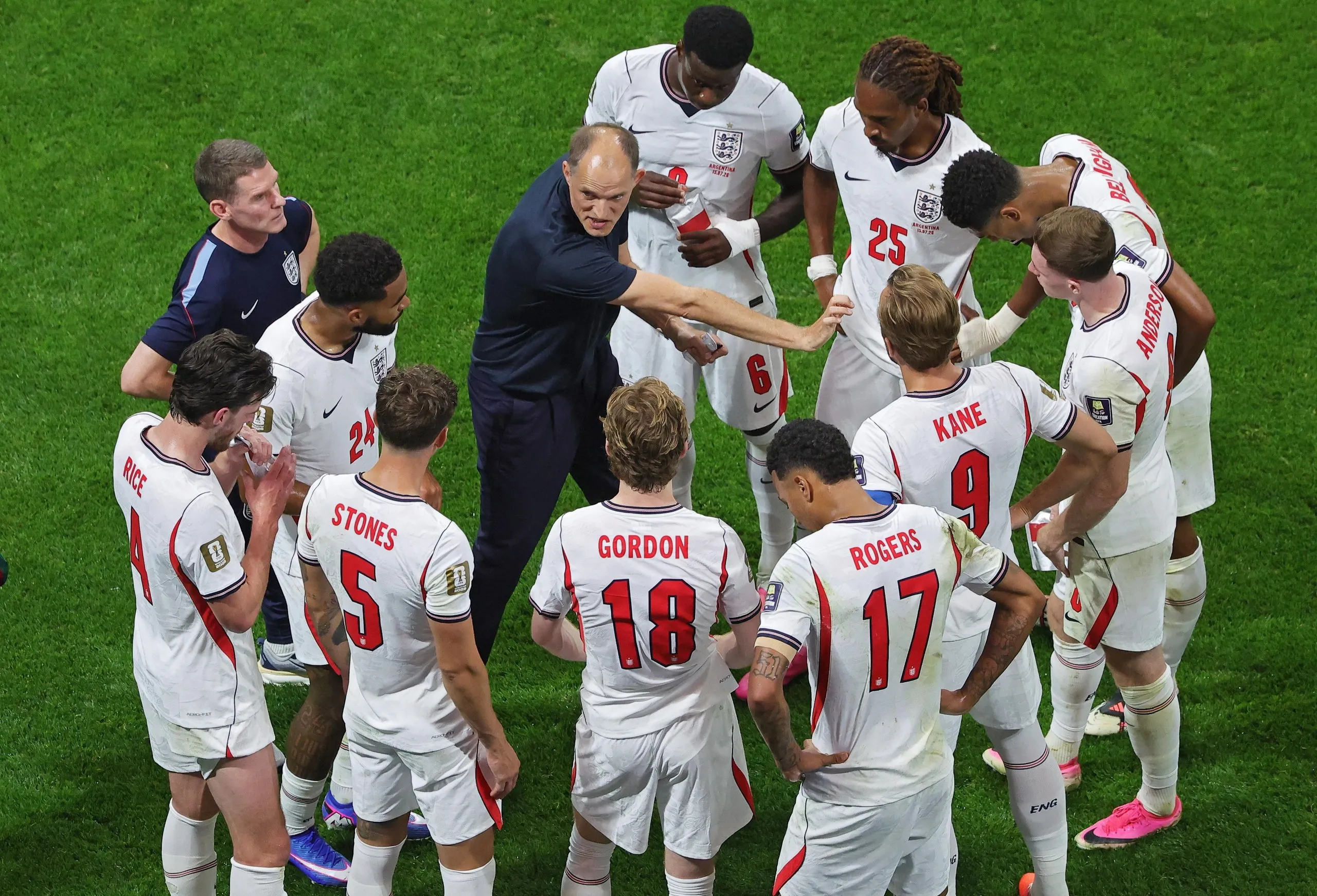 England’s head coach Thomas Tuchel talks to players during the first hydration break