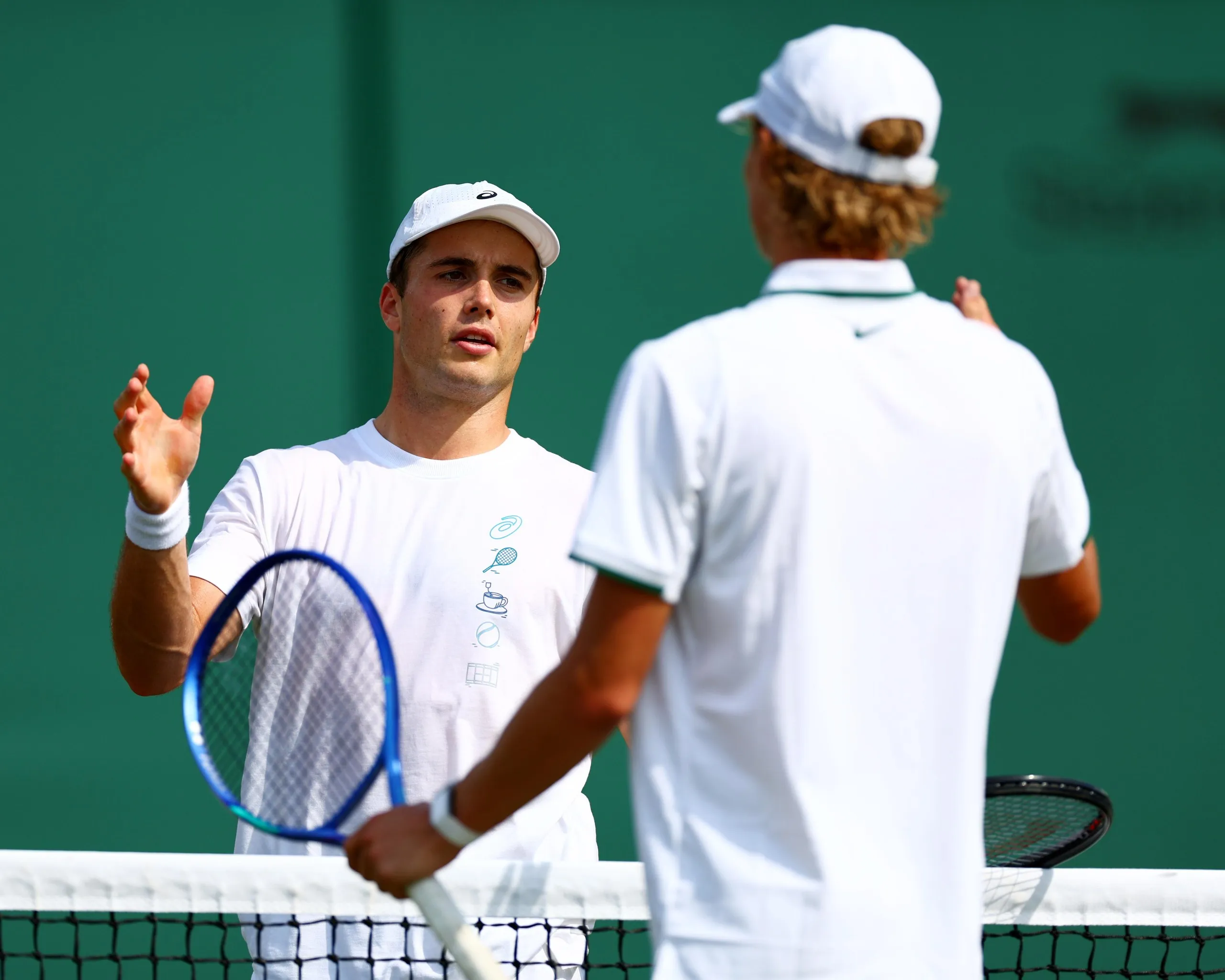 Arthur Fery practises on court with Cruz Hewitt before his main draw semi-final
