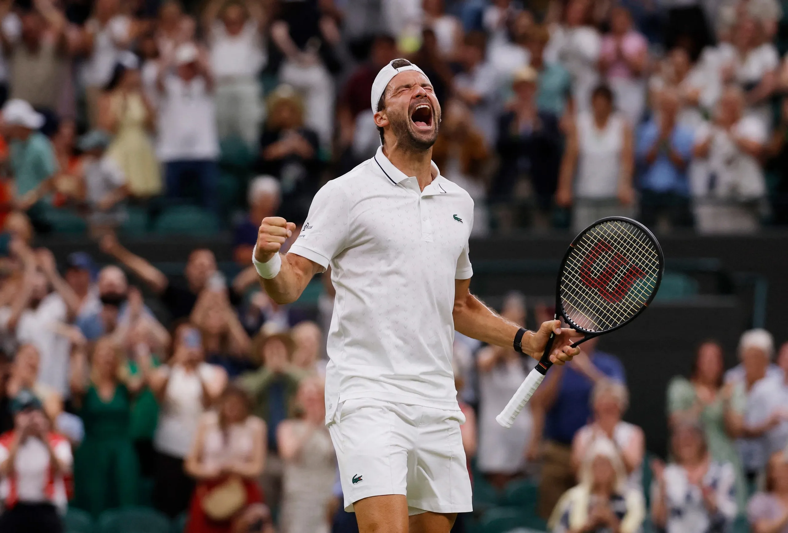 Grigor Dimitrov celebrates after winning his second round match against Jakub Mensik.