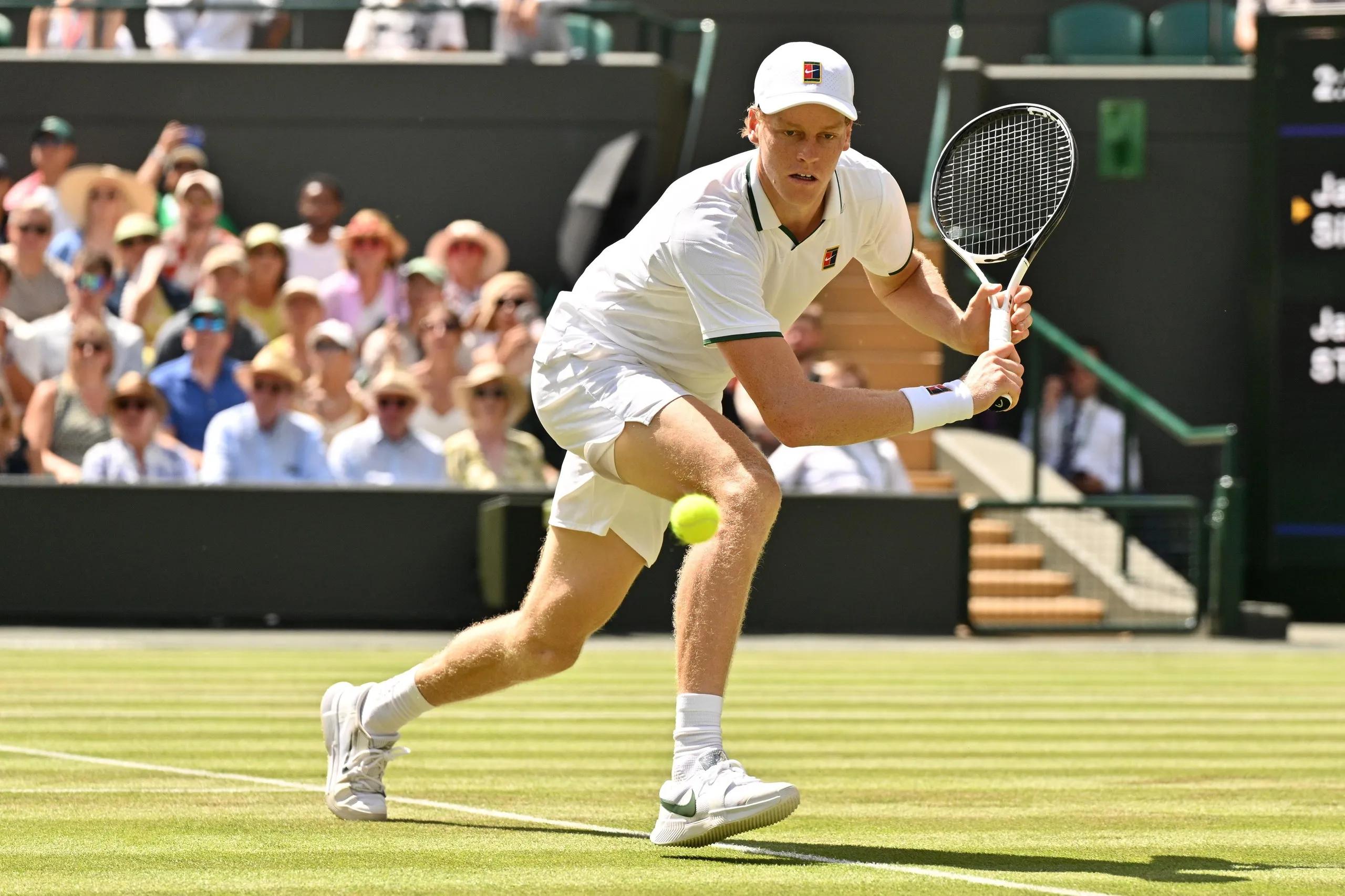 Jannik Sinner hits a backhand to Jan-Lennard Struff