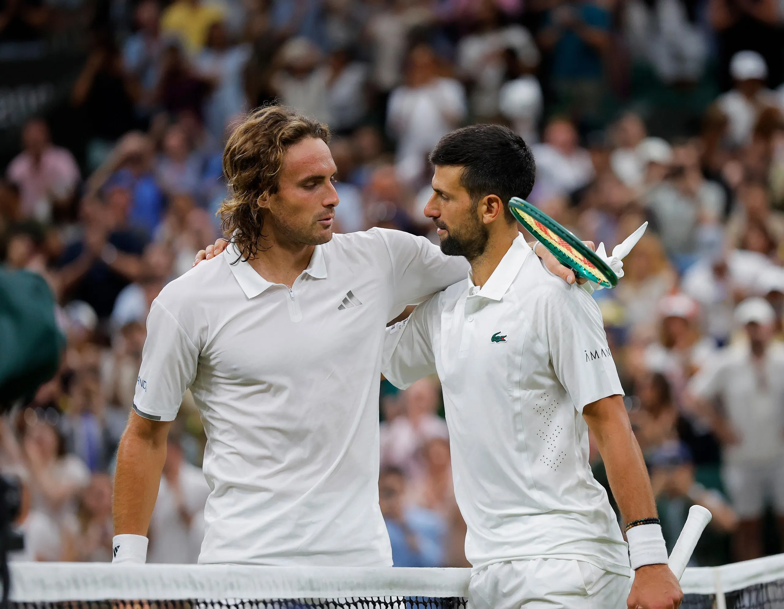 Novak Djokovic and Stefanos Tsitsipas embrace