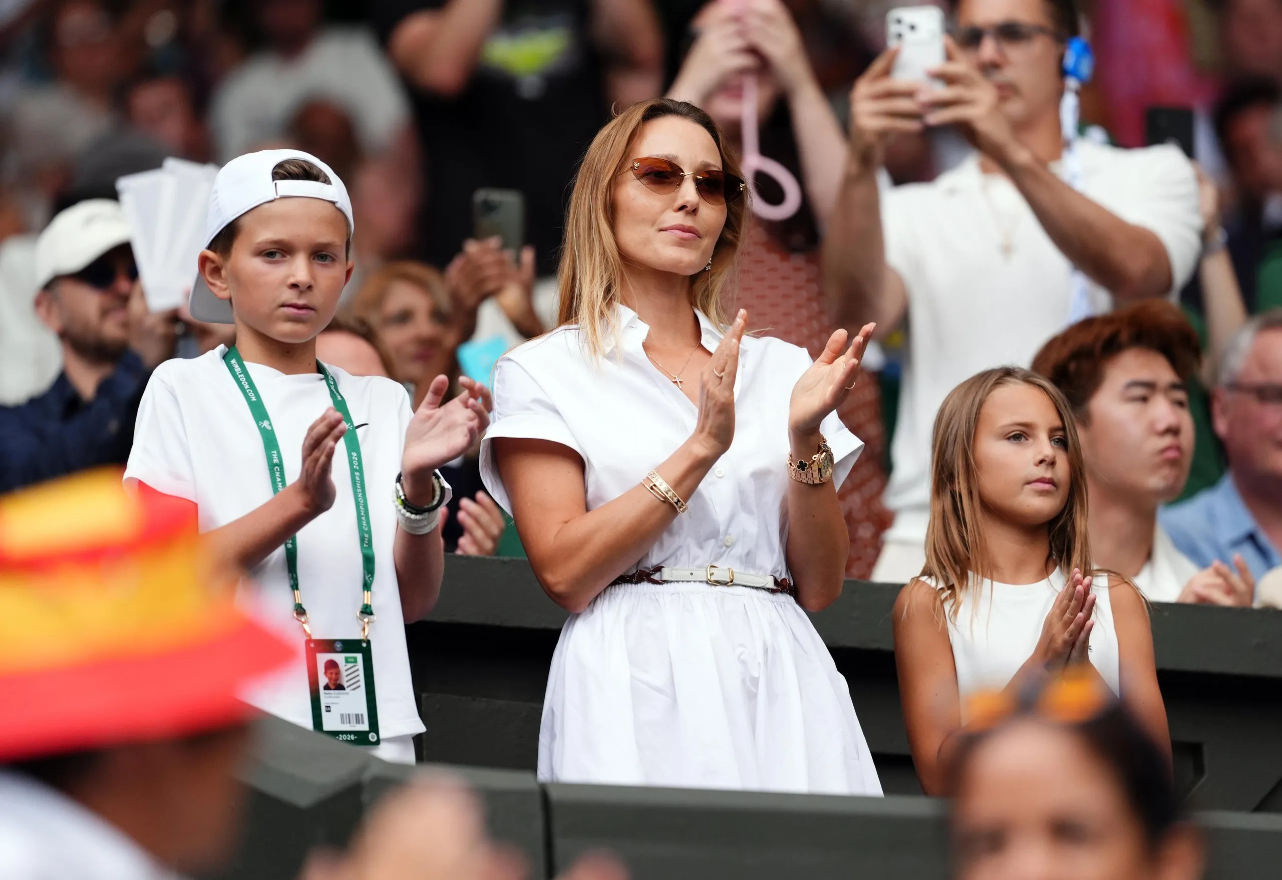 Wimbledon 2026 - Day One - All England Lawn Tennis and Croquet ClubJelena Djokovic, wife of Novak Djokovic with her son Stefan (left) and daughter Tara (right) on day one of the 2026 Wimbledon Championships at the All England Lawn Tennis and Croquet Club, London. Picture date: Monday June 29, 2026. PA Photo. Photo credit should read: John Walton/PA Wire. RESTRICTIONS: Editorial use only. No commercial use without prior written consent of the AELTC. Still image use only - no moving images to emulate broadcast. No superimposing or removal of sponsor/ad logos.