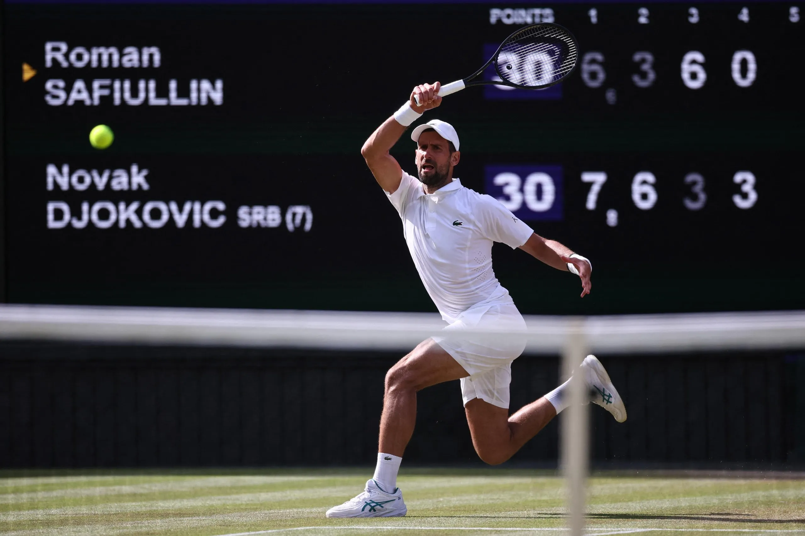 Novak Djokovic hits a return