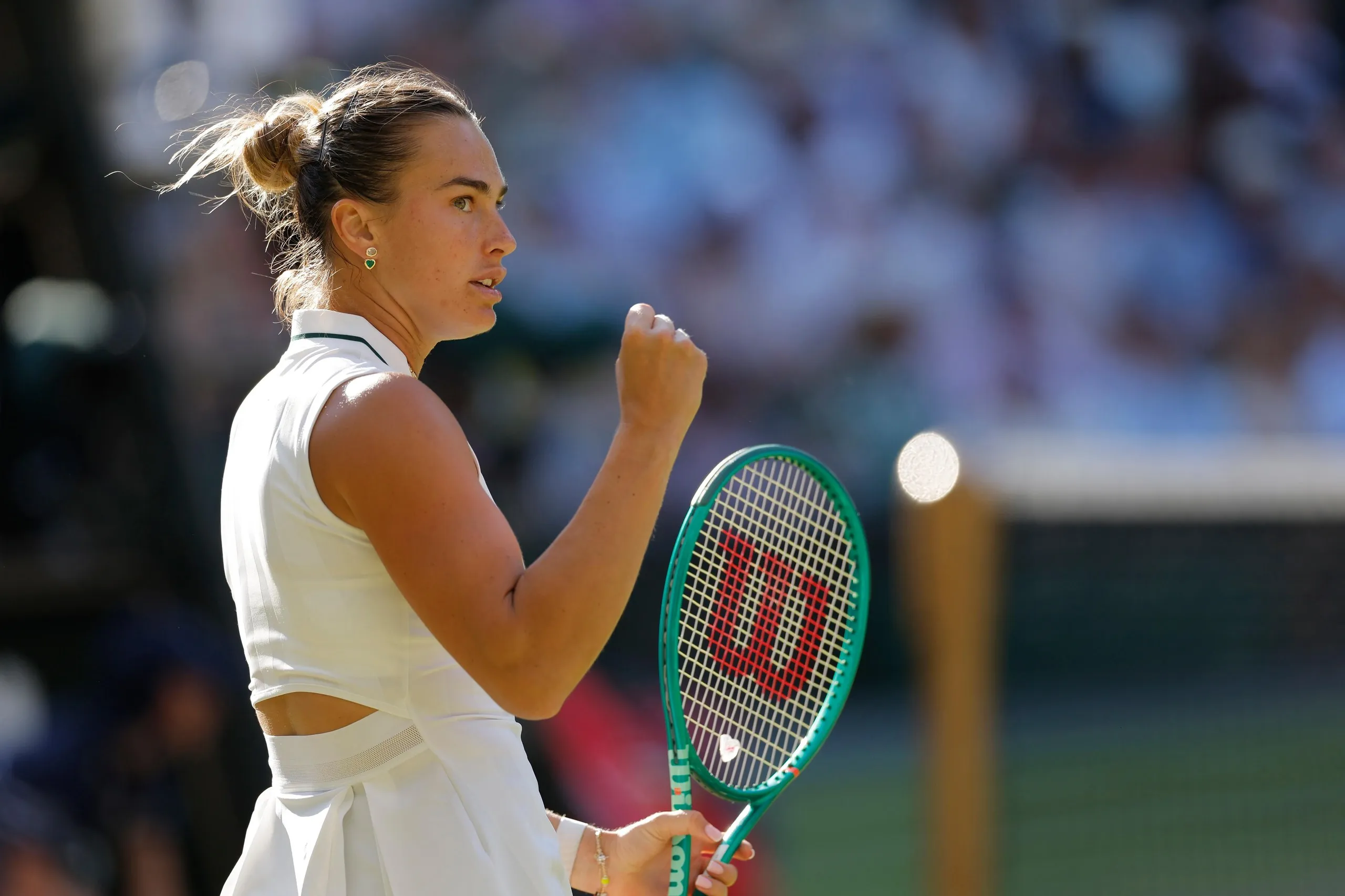 Aryna Sabalenka clenches her fist after winning a point.