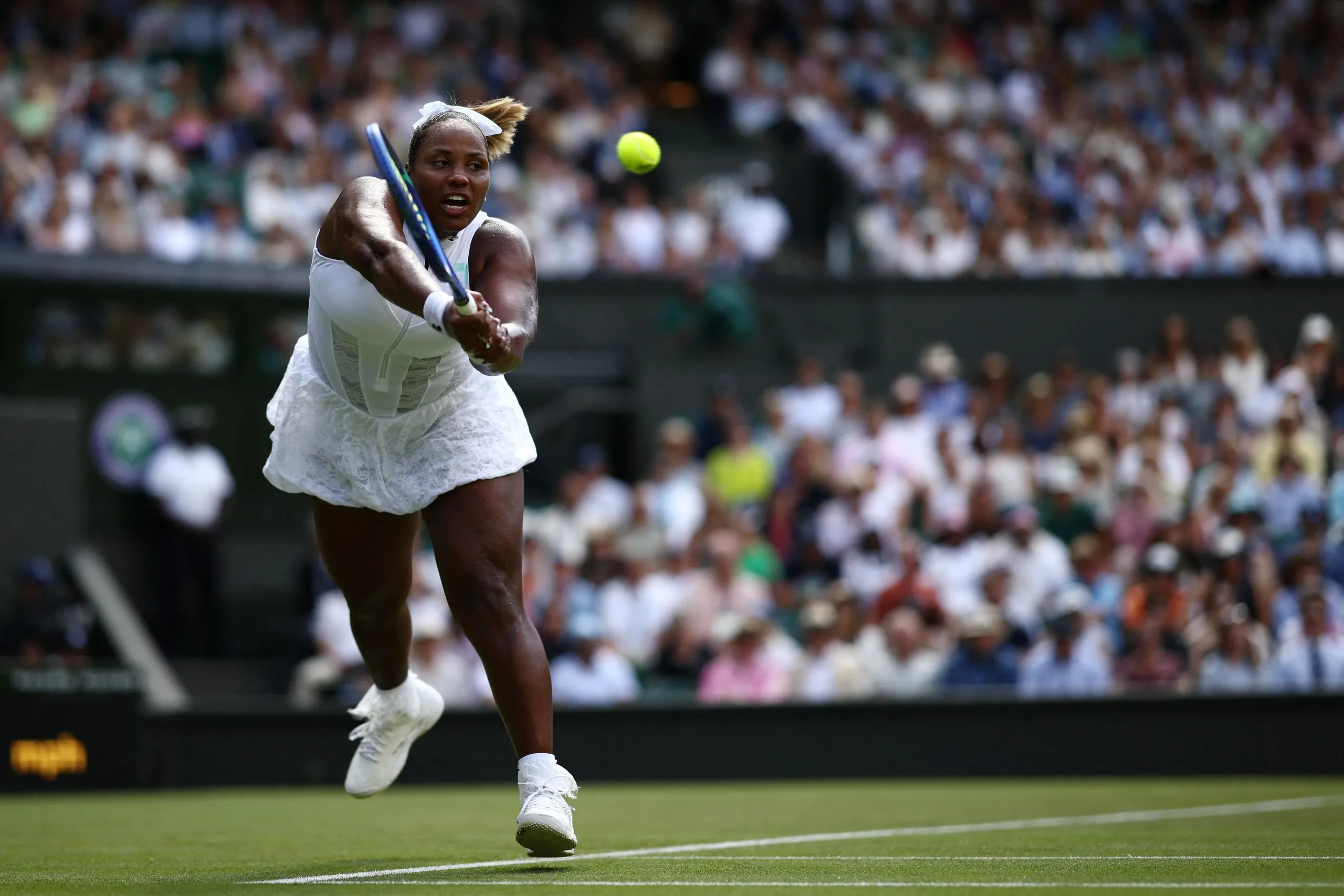 Taylor Townsend returns the ball against Iga Swiatek during their women’s singles first round match at Wimbledon 2026.