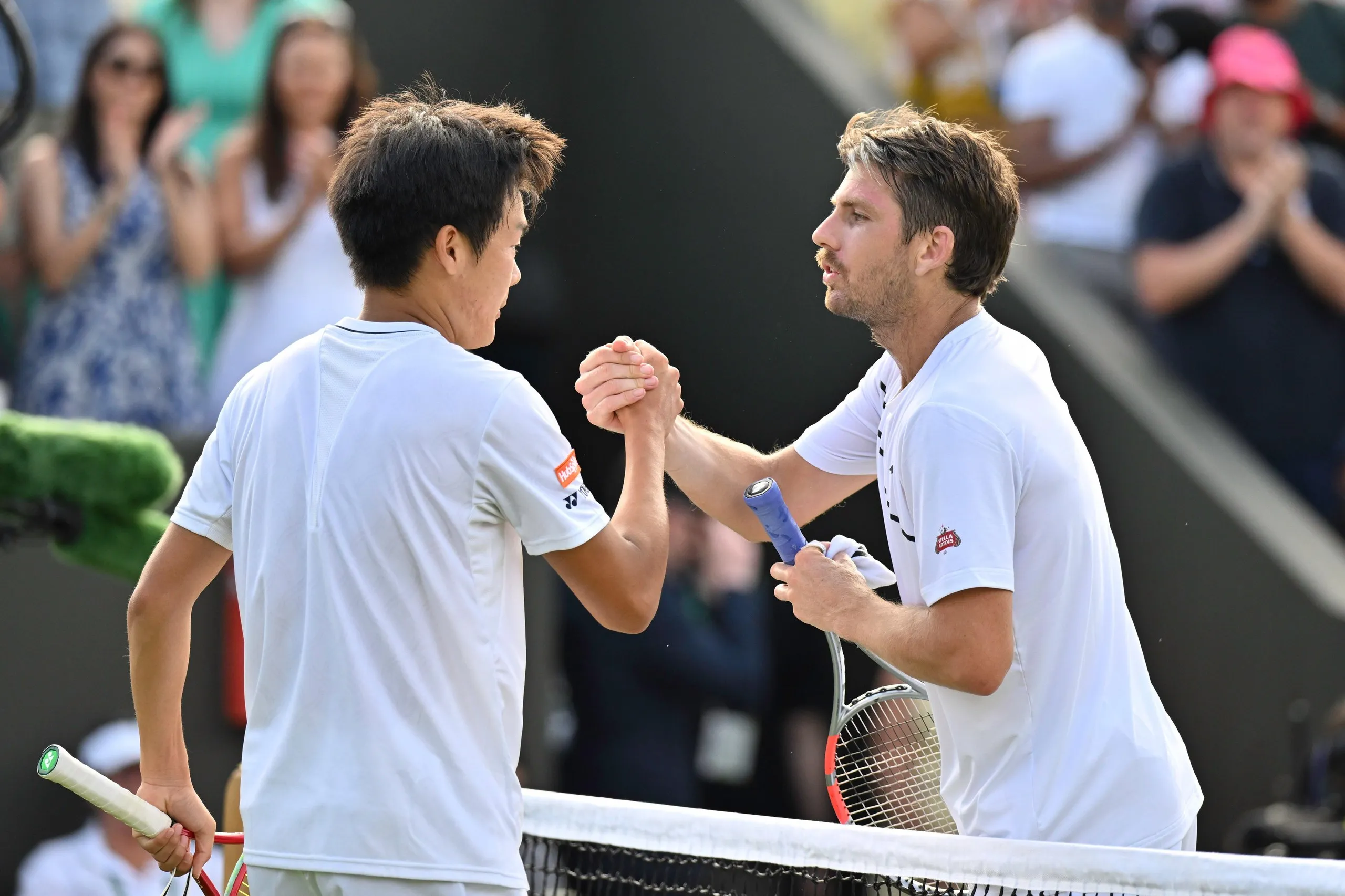 Cameron Norrie congratulates Michael Zheng on his victory